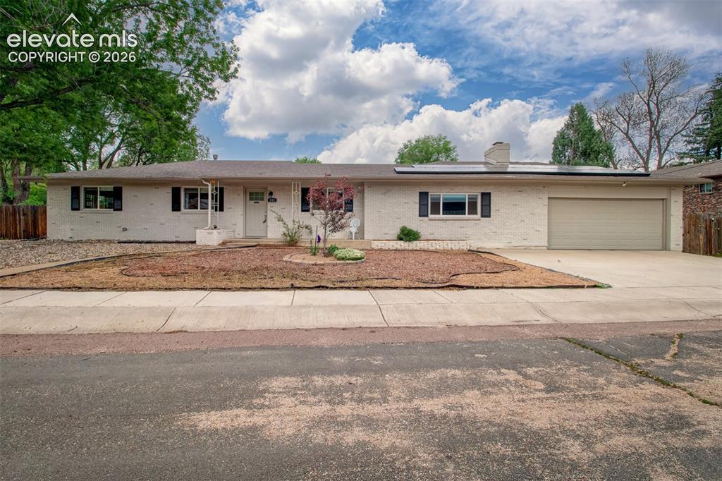 WELCOME HOME to this beautifully remodeled rancher tucked into the heart of the highly sought-after Cheyenne Mountain area. Nestled on an incredible .35-acre lot surrounded by mature trees, this home perfectly blends timeless character, thoughtful updates, and an unbeatable location within award-winning D-12 schools. The charming 1956 brick exterior immediately sets the tone, offering warmth and curb appeal that feels both classic and inviting from the moment you arrive. Whether you’re sipping coffee from the welcoming front porch as the neighborhood slowly wakes up or enjoying a peaceful morning on the back deck overlooking the private backyard and pasture beyond, this home creates the kind of everyday moments that simply feel special. Inside, you’ll find a remodeled 3-bed, 2-bath layout filled with warmth, natural light, and elevated finishes throughout. Extensive renovations breathed new life to the home while preserving its original charm, including new windows, roof, gutters, furnace, water heater, upgraded electrical panel with arc fault breakers, new driveway & sidewalk, beautifully refinished original hardwood floors, high-end soft-close cabinetry, and top-of-the-line Whirlpool appliances. Two cozy wood-burning fireplaces create inviting gathering spaces, while the spacious family room with walk-out access seamlessly connects indoor and outdoor living. The oversized 2-car garage offers additional flexibility for storage, hobbies, or workshop space, and the paid-off solar adds long-term efficiency and value. Step outside and experience your own private Colorado retreat complete with a wood deck, pergola, raised garden beds, and room to relax, entertain, and unwind beneath the trees. Perfectly positioned minutes from Cheyenne Canyon, The Broadmoor, Cheyenne Mountain Zoo, Bear Creek Park, Downtown, Old Colorado City, Manitou Springs, trails, shopping, dining, and quick I-25 access, this location truly offers the best of Colorado living at the end of the Rainbow.