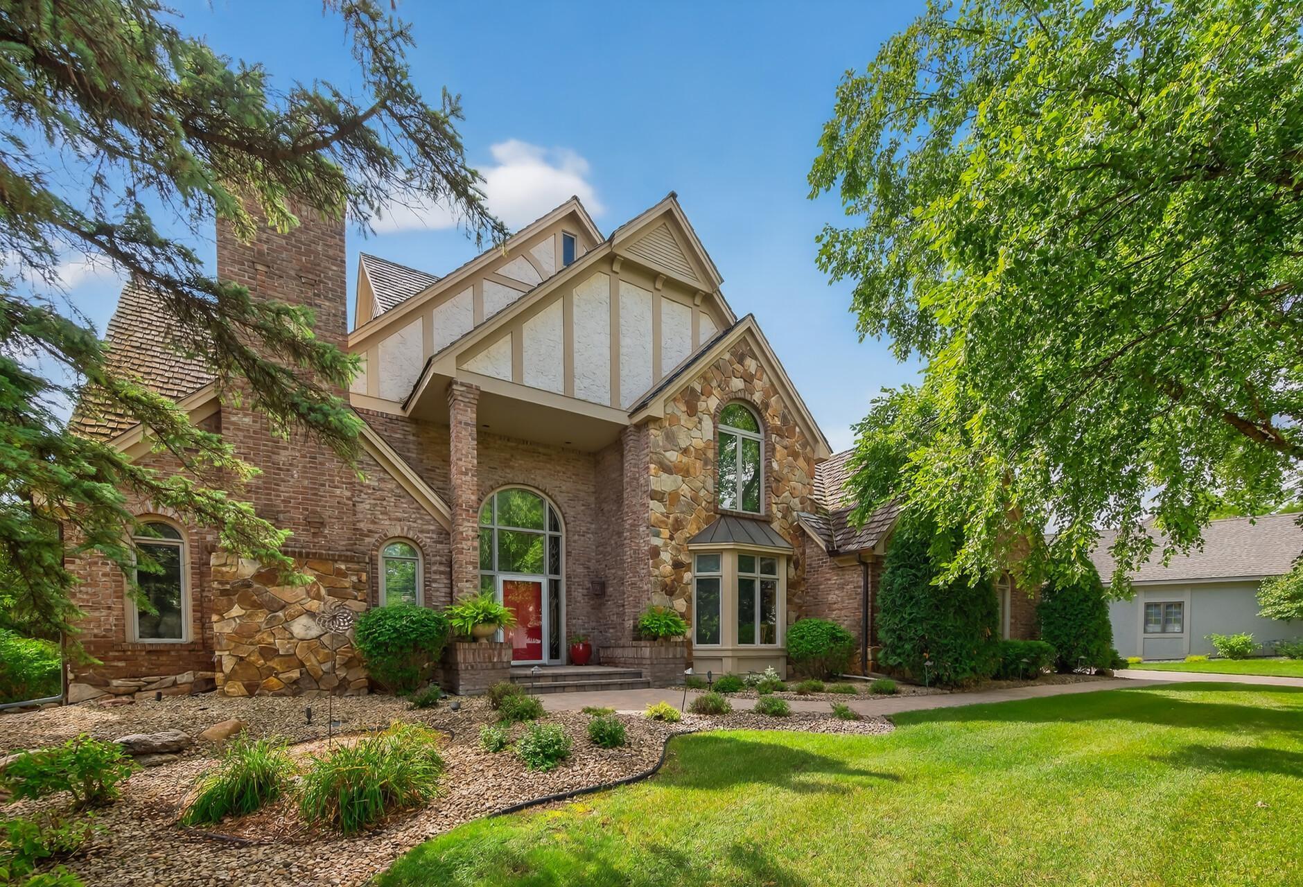 **Multiple Offers received!  Sellers will be reviewing offers at 1 PM Saturday 11/8.**   Welcome to the prestigious Kenmare Shores neighborhood, this one-of-a-kind custom home blends timeless design with breathtaking Minnesota River views.  With nearly 5,500 square feet of thoughtfully crafted living space, this floorplan offers space for everyone.  Freshly painted throughout, the main level features soaring ceilings, walls of windows, and a seamless flow between the living room, chef's kitchen with updated appliances, dining area and large deck, perfect for both entertaining and everyday living. Upstairs, the serene owner's suite offers a spa-inspired bath with steam shower, generous walk-in closet, and a cozy sitting area or office overlooking the river.  The walkout lower level is ideal for entertaining or multigenerational living, complete with additional en-suite bedrooms, generous gathering spaces, plenty of storage and a large exercise room. Step outside to your beautifully updated landscaped, fenced in private backyard with an in-ground pool, the ultimate setting for summer relaxation which you can look forward to all winter long.  Convenient location set on a private, tree lined lot with a 3 car garage and easy access to parks, trails, shopping, dinning and the best of the Twin Cities, this executive home has it all!