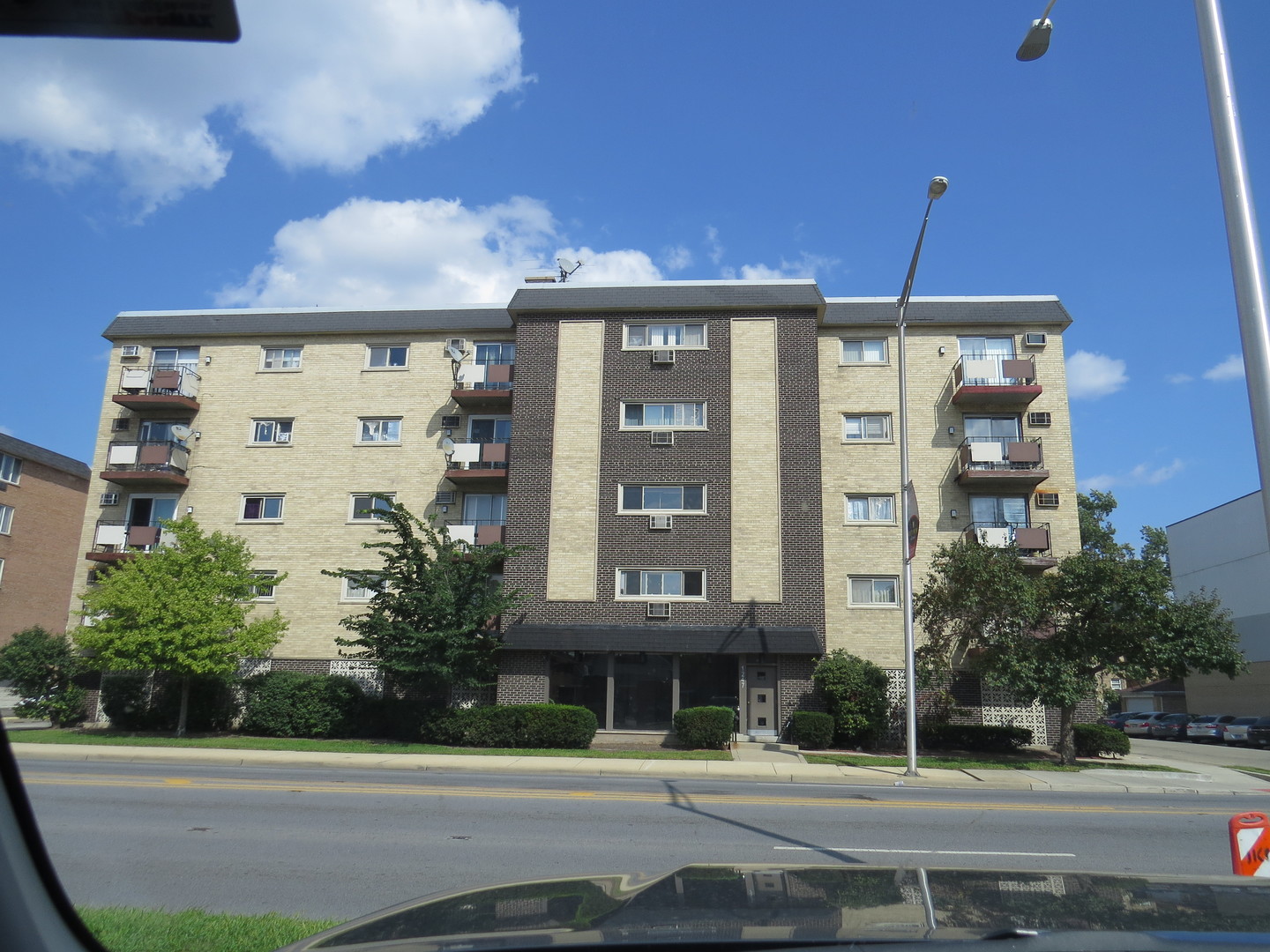 Rarely available Top Floor End Unit !! Assigned Indoor garage parking included in price. ( extra wide corner parking spot with storage cabinets included) Light and Bright with a fabulous cross breeze !!        1 br/1ba unit with Harwood floors in Living room, dining room and bedroom. New ceramic tile at entry and new flooring in bathroom. Catch the beautiful sunsets from the West facing top floor balcony !!  Freshly painted and ready for your personal touches !! Just a few steps away from your laundry room and storage cage. Building has a secure entry intercom door in an elevator building. Low taxes & assessments (include heat, gas & water). Minutes 290 & walking distance to public transportation that takes you to downtown Chicago (Blue Line) or the Western Suburbs (Metra). Close to both MacNeal and Loyola Hospital. Pet friendly building. There are no rentals allowed.