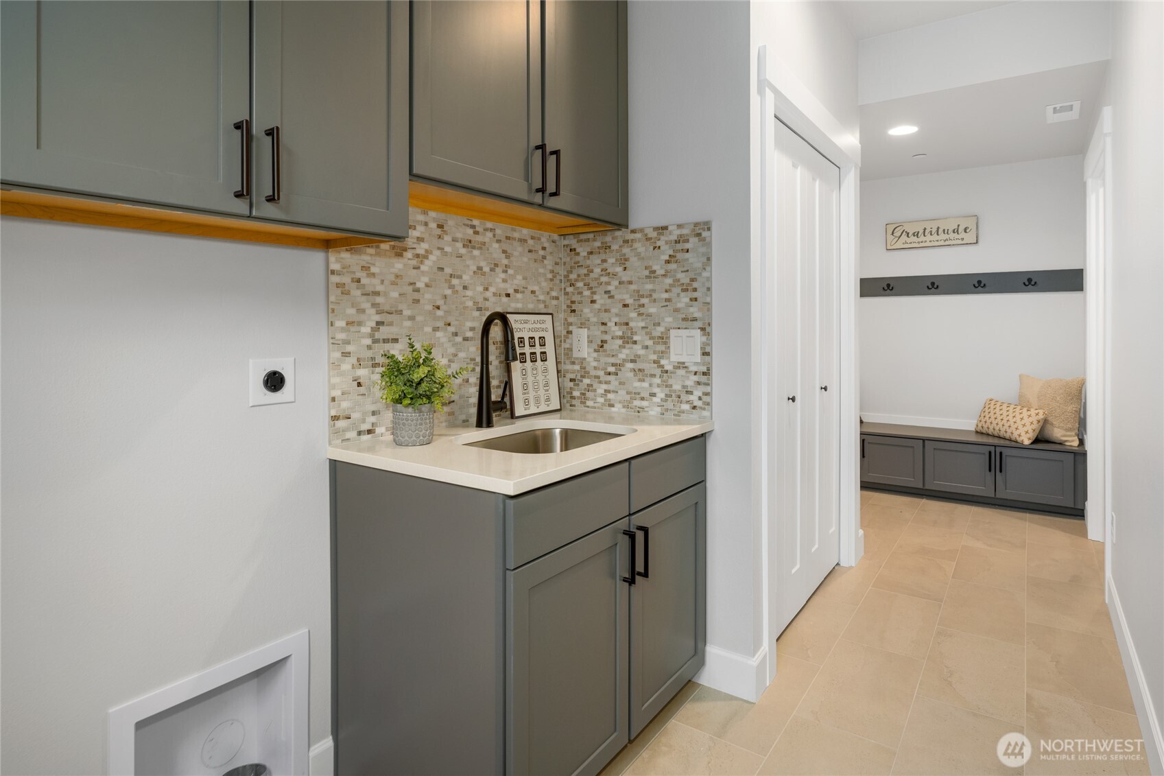Laundry room with sink.