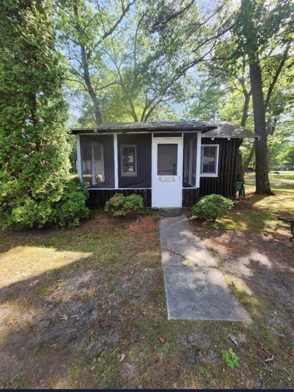 Come take a look at this charming 2 bedroom, 1 bath log cabin located just 5 miles north of downtown East Tawas. Cabin features a screened in porch area to sit and relax. Cabin is ready for private use or a great addition to an investors portfolio. Low monthly association fees of $125. Beach access to Lake Huron included with association fees.BATVAI