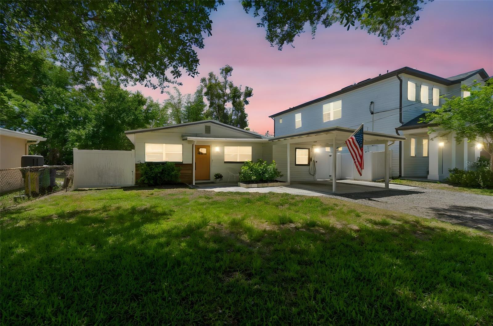 Welcome to this beautifully updated home in highly desirable South Tampa, just minutes from MacDill Air Force Base! This 3-bedroom, 2-bath residence offers a perfect blend of modern upgrades, flexible living space, plus a new roof (2023), new HVAC system (2023) & updated plumbing!   All this is set on an oversized, fenced lot with inviting curb appeal.  Arrive to a charming gravel driveway and a beautiful mature tree that enhances the front of the home, creating a warm and welcoming first impression. Step inside to an open foyer that flows seamlessly into the living room and kitchen, where luxury vinyl plank flooring runs throughout the main living areas.  The kitchen is a true standout, featuring Frigidaire stainless steel appliances, quartz countertops, a designer tile backsplash, and a generously sized island with a stunning waterfall quartz edge—perfect for both everyday living and entertaining. Soft-close cabinetry and drawers add a touch of quality craftsmanship.  Down the hall, you’ll find two guest bedrooms, a spacious primary suite, and a beautifully appointed bathroom complete with quartz countertops, modern gold fixtures, floor-to-ceiling tile in the shower, and a separate tub. To the right of the foyer, a large step-down bonus/TV room with a closet and adjacent full bath offers incredible versatility—easily functioning as a second living area, guest suite, or potential 4th bedroom with minor modification.  Additional highlights include a 2023 roof and HVAC system, new easy-operating shades throughout, and a convenient covered carport. The expansive screened and covered lanai features durable composite decorative plank flooring and provides the perfect space for relaxing or entertaining, while the extended paver patio overlooks the huge backyard enclosed by a white PVC fence.  With its thoughtful updates, flexible layout, and prime South Tampa location, this home is a must-see!  Located just minutes from MacDill Air Force Base, South Tampa’s popular restaurants and bars, shopping, Gulf beaches, Downtown Tampa, Armature Works, and sporting events, this home offers both convenience and the privacy of a tucked-away street — a rare combination at this price point.