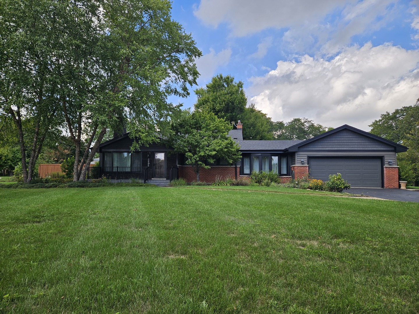 A Rare Find in Arlington Heights! Discover the perfect combination of location, land, and luxury with this beautifully updated 2-bedroom, 2-bathroom home set on an expansive 0.7-acre corner lot. This one-of-a-kind property offers privacy, space, and endless opportunities in one of the most desirable neighborhoods.    Step into the expanded kitchen showcasing stylish two-tone cabinetry, granite countertops, stainless steel appliances, and a cozy eat-in nook with views of the newly fenced backyard-ideal for entertaining or relaxing outdoors. The main level features gleaming hardwood floors and a warm fireplace centerpiece, creating a welcoming flow into every room. Upstairs, two spacious bedrooms complement a spa-inspired bathroom suite, thoughtfully converted from a third bedroom. Indulge in the jetted tub, double vanity, seated walk-in shower, bidet, and private makeup area.    The finished lower level provides a versatile family room, updated full bath, and laundry space. Tech-forward upgrades include a Tesla battery backup system and a garage pre-wired for a 240V EV charger-a modern convenience rarely found at this price point.    Additional updates bring peace of mind: replacement roof (2018), newer windows, HVAC, stainless appliances, washer/dryer, and fencing. Outside, enjoy multiple outdoor living areas across this spectacular oversized lot.    Located near top-rated schools, daily conveniences, and the highly anticipated new Chicago Bears stadium, this home blends immediate comfort with long-term investment value. Truly a rare opportunity to own a property that checks every box-schedule your showing today and experience the lifestyle this home offers.