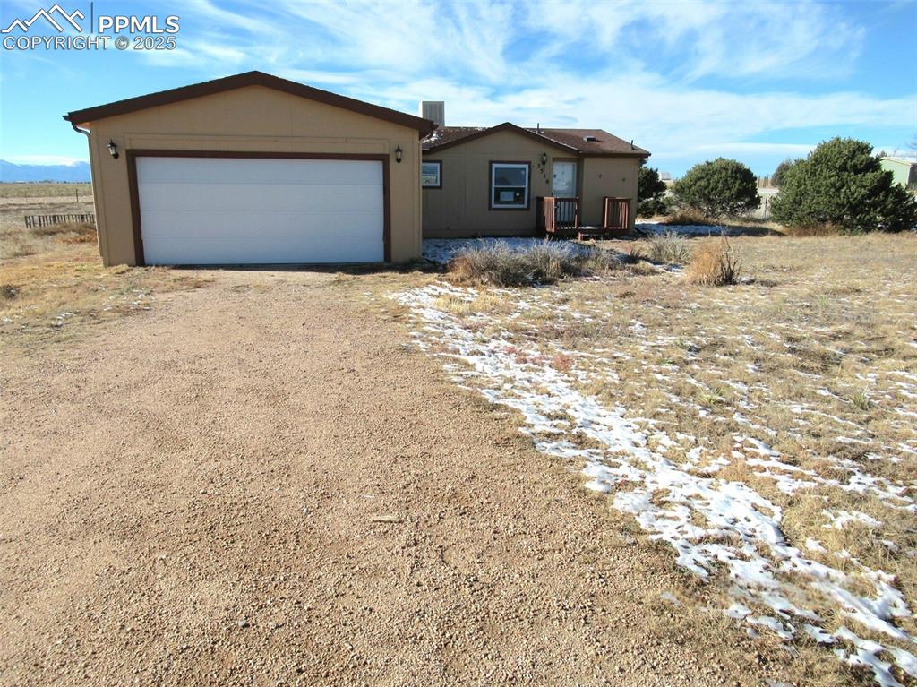 Welcome to this great ranch style home with an attached two car garage, open floor plan, and beautiful views of Pikes Peak and the Front Range. Potential to get off the grid with this nice home, only about 20 minutes away from the powers corridor. This fenced property boasts 2.5 acres with outside amenities to include a loafing shed, small storage shed, fenced backyard, and trees lining part of the north side of the house. Bonus feature is an outdoor dog run with access from the garage. Add your loving touches to this great property and you'll have a home that you'll never want to leave.With no HOA and RR-2.5 zoning - you can bring your animals! This property offers rare freedom and functionality.Step outside to the expansive 2.5-acre lot, where you'll find plenty of space to create your own outdoor oasis. Whether it's gardening, outdoor activities, or simply relaxing while soaking in the mountain vistas, this property offers endless possibilities.The attached 2-car garage provides convenient storage and parking, and the property's rural location offers privacy and peace, while still being within a short drive of all the amenities, shopping, dining, and recreation the Powers Corridor has to offer. It's also in close vicinity to military bases.If you’re looking for the perfect combination of space, tranquility, and mountain views, this home is a must-see!