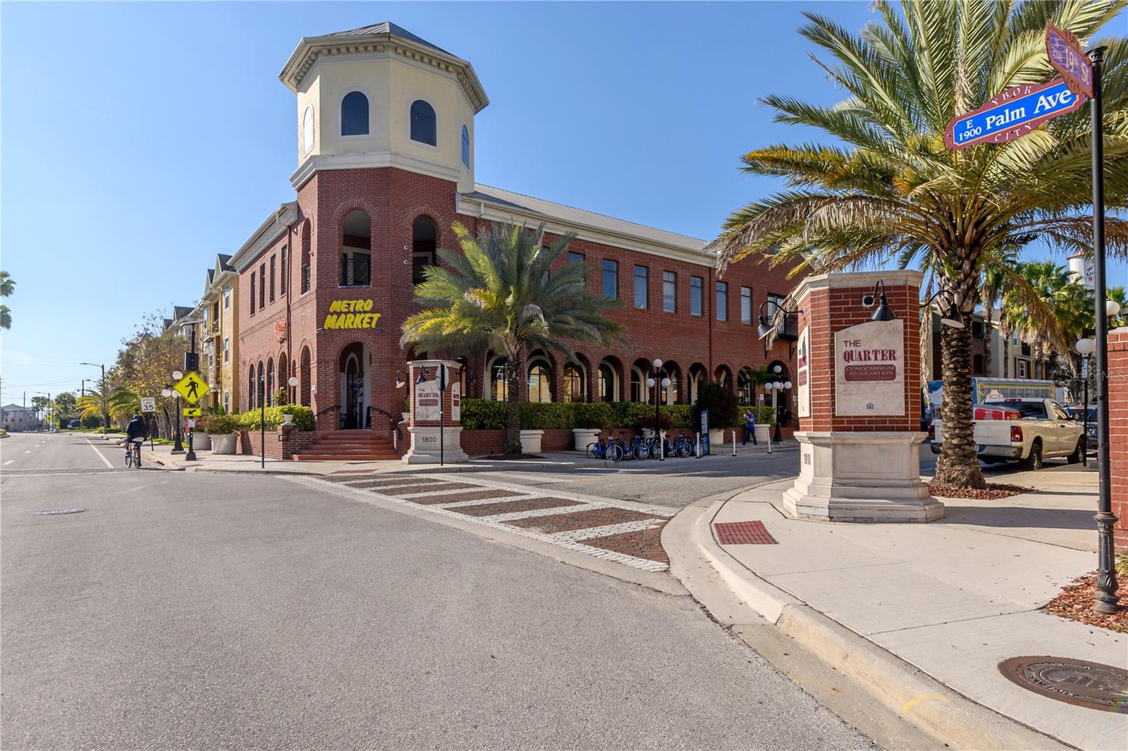 YBOR CITY!!! Walk to it all ..... Quiet Community Blocks From ALL the Hot Spots Ybor City has to Offer!! Amazing 2 Bedroom / 2 Bath First Floor Condo WITH PRIVATE ENTRANCE FROM THE STREET - Completely Updated with Engineered Hardwoods and a Muted Paint Scheme Throughout - The Eat-In Kitchen has an Abundance of Cabinets, Quartz Counter Tops, Stainless Steel Appliances, an Under Mount Sink with a Goose Neck Faucet, and a Subway Tile Backsplash - The Owners Retreat Includes an En Suite Bath with a Frameless Glass Enclosed Stand-In Shower and Double Vanities and a Large Walk-In Closet with a Closet Organization System - The Second Bedroom has an Abundance of Storage with Access to Both the the Guest Bath and the Living Spaces - GINORMOUS Laundry Room with a Laundry Sink and DECORATIVE BARN DOOR CLOSURE  - Outdoor Patio has a Gate And Allows for Direct Street Access - It Also Includes REMOTE CONTROLLED SCREEN Which TRANSFORMS THE PATIO INTO A LANAI - HVAC SYSTEM (2021) and RHEEM WATER HEATER (2020) - Also Includes a HOME AIR PURIFIER, Which Helps to Reduce the Presence of Viruses, Mold Spores, Dust, and Dander within the Unit - SPECIAL ASSESSMENT PAID IN FULL - The Community Features 2 Resort Style Pools, a Fitness Center, Community Room with Full Kitchen, Pool Table, Foos Ball Table, Outdoor Patio, and Stadium Seating Private Theater - Gated Community with Manager On Site - Close to the First Trolley Stop - Providing Access to Publix, the Channel District, Sparkman's Wharf, Amalie Arena, and Downtown Tampa
