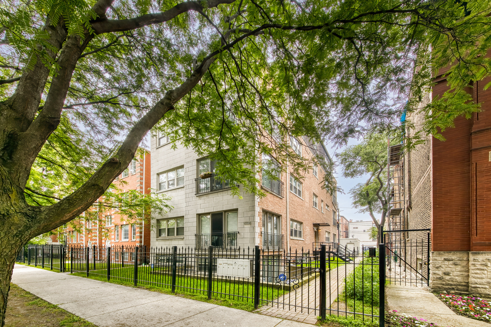 Welcome to Your Dream Home in Wicker Park!Step into this stunningly renovated 3-bedroom, 3-bath duplex that seamlessly blends luxury, function, and style. From the moment you enter, you're greeted by soaring ceilings, abundant natural light, and an expansive open floor plan that creates an impressive sense of space.  The spacious living area flows effortlessly into a chef's kitchen designed for both beauty and performance. It features sleek, European-style flat-panel cabinetry, high-end Bosch stainless steel appliances, Quartz countertops with a dramatic waterfall edge, and a striking full-height Quartz backsplash. A thoughtfully relocated laundry room to the lower level allows for the addition of a generous walk-in pantry, and a built-in beverage center at the peninsula makes entertaining a breeze.  Adjacent to the kitchen is a dedicated dining space with views of one of the home's two private outdoor areas-perfect for summer gatherings or morning coffee.  The main level also includes a large bedroom with ample closet space including a custom overhead storage cabinet to take advantage of the tall ceilings. A full bathroom with a walk-in shower and designer finishes serves this level, offering comfort and style for guests or family.  Downstairs, the cozy and inviting family room opens to a second, wraparound private patio, creating seamless indoor-outdoor living. The expansive primary suite is a true retreat, boasting a walk-in closet and spa-inspired bath with dual vanities, heated floors, and a massive glass-enclosed steam shower with body sprays.  The third bedroom is also ensuite, featuring a deep soaking tub/shower combo-ideal for any age range.  Additional features include garage parking and a location that can't be beat-tucked away on a quiet street in the heart of Wicker Park, just a short stroll to shopping, dining, nightlife, and transit.