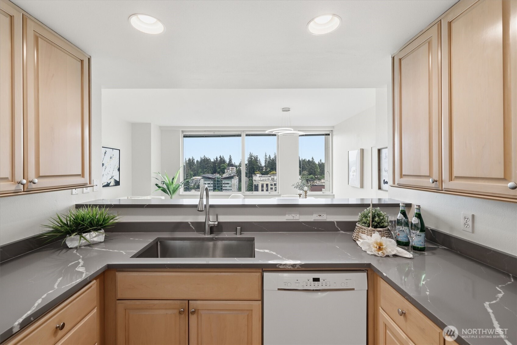 Welcome to Bellevue Pacific Towers, where refined urban living meets effortless elegance. This stunning 2-bedroom, 2-bath residence has been fully reimagined with all-new paint, carpet, laminated wood floors, designer lighting, and premium fixtures throughout. The remodeled kitchen stuns with quartz countertops and new stainless steel appliances, flowing seamlessly into an open floor plan framed by sweeping views of Mt. Rainier and the glittering Bellevue skyline — visible from every room. Expansive windows flood the space with exceptional natural light all day long. World-class amenities elevate every moment: 24/7 concierge, fitness center, indoor pool, whirlpool spa, sauna, private screening room, dog park, and rejuvenating outdoor terraces. Your HOA covers heat, A/C, water, sewer, 1G internet, cable, and earthquake insurance — true lock-and-leave living. One secure underground parking space included, with guest parking on-site. No rental cap. Step outside and Bellevue's best awaits. Walk to Amazon and Microsoft campuses, Bellevue Square's 200+ shops, award-winning restaurants, Downtown Park's fountains and gardens, grocery stores, and light rail access. Less time maintaining. More time living.