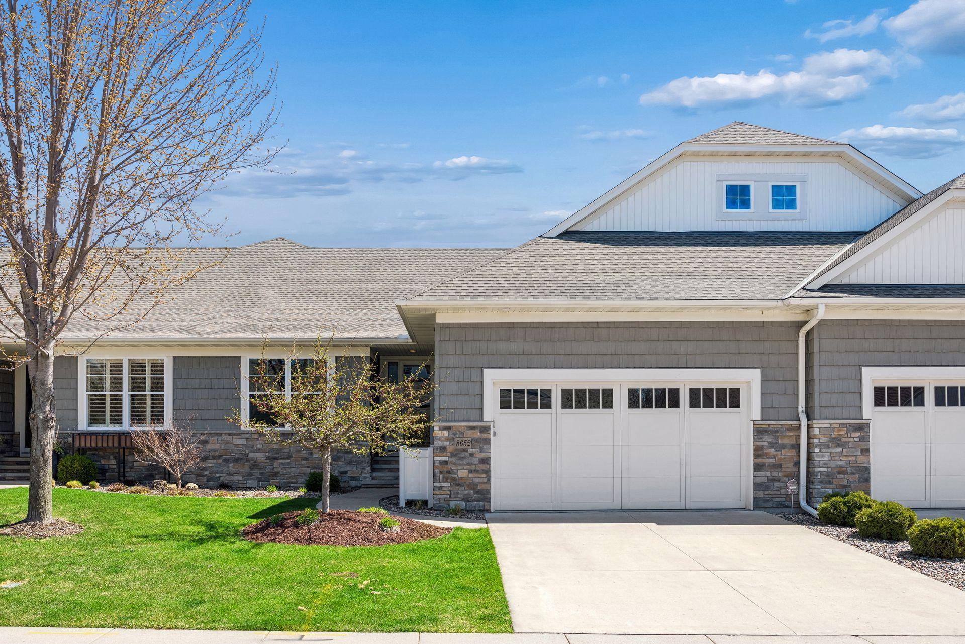 Welcome to Lakeside at Lake Riley, where every detail of this custom Wooddale Builders home was designed to make life a little easier and a lot more enjoyable! This highly desirable community offers main level living at its finest along with resort-style amenities, including a private clubhouse, outdoor heated pool, party room, fitness center, beach, dock, lake access and pontoon rentals. This townhome boasts three bedrooms and three bathrooms across 3,160 finished square feet. Gorgeous hardwood floors guide you past the home office. The gourmet kitchen features a center island, designer tile backsplash and stainless-steel appliances. Entertain in the spacious dining room or in front of the living room fireplace. Completing the main floor is the sunroom, screened porch, primary bedroom with full bathroom, and laundry room. The walkout lower level showcases the family room, flex room, and two bedrooms with an adjacent three-quarter bathroom. In addition to the community amenities, enjoy easy access to trails, parks, award winning golf courses and nearby downtown Chanhassen.