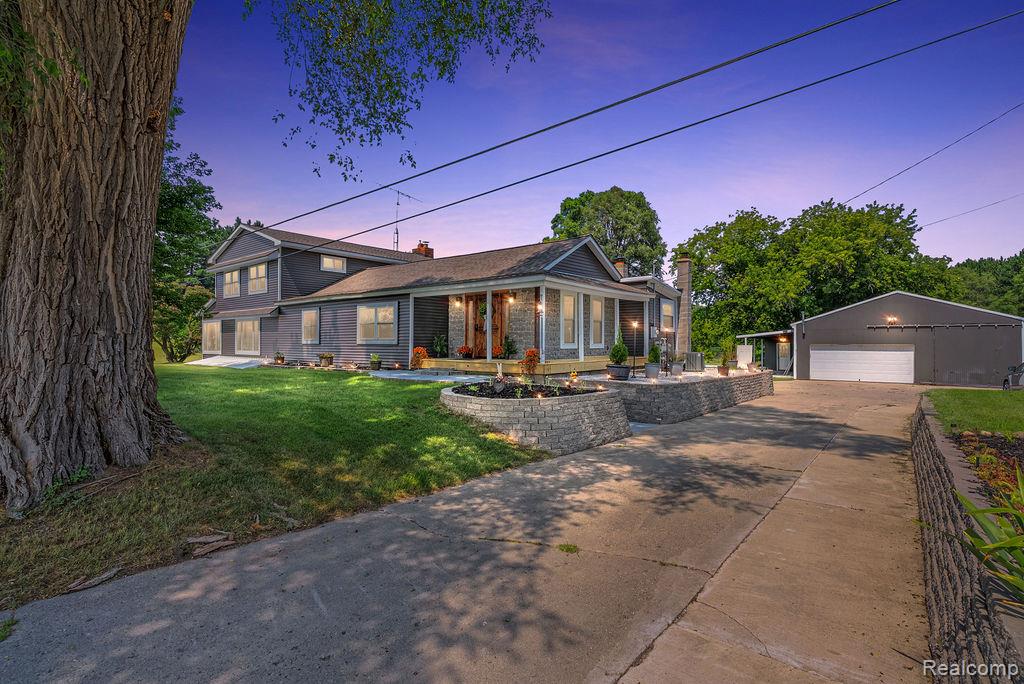 Welcome to 772 Angle Road in Lapeer, an updated Colonial style home full of charm, space, and unique features that set it apart. This one and a half story home has been fully renovated from 2021 through 2025, blending modern finishes with its original character.  The siding, windows, roof, furnace, central air, and well were all replaced in 2021.

The heart of the home is a massive kitchen designed for entertaining, featuring a large indoor wood fired brick oven and a custom built hibachi grill, perfect for hosting family and friends.

Outside, enjoy a private motocross track for riding enthusiasts, a spacious 30x40 garage with a 16x18 addition tool shop and a 25x25 shed for storage or workshop needs. Whether you're looking for room to grow, space to ride, or peace and quiet in the country, this home has it all.
