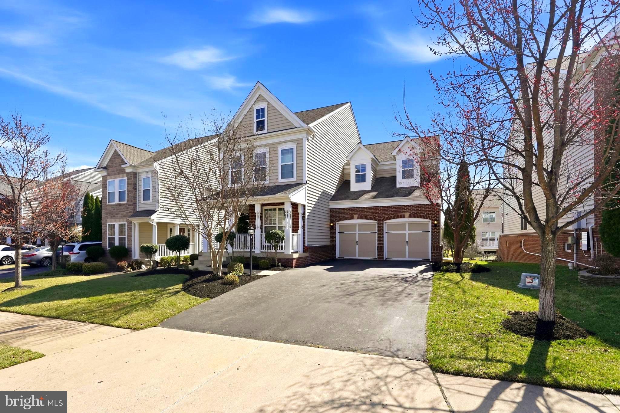 Built by Pulte Homes, this beautifully updated Allegheny model offers over 4,000 square feet of refined living across three finished levels in the heart of sought-after Brambleton. With 5 bedrooms and 4.5 baths, this home seamlessly blends timeless architecture with modern upgrades designed for today’s lifestyle.A welcoming front porch sets the tone, while rich hardwood flooring, elegant moldings, and abundant natural light define the main level. The gourmet kitchen anchors the home with cherry cabinetry, an oversized center island, gas cooktop, double wall ovens, stainless steel appliances, and a sun-filled breakfast area with access to the backyard—ready for your custom outdoor design. The adjacent family room features a gas fireplace, creating a warm and inviting gathering space. A private main-level office with French doors offers the perfect work-from-home setting.Upstairs, four spacious bedrooms, a flexible loft area, and a convenient upper-level laundry room provide both comfort and functionality. The expansive primary suite impresses with a tray ceiling, generous walk-in closet, and a spa-inspired bath featuring dual vanities, a soaking tub, and a glass-enclosed shower. Fresh carpet and updated lighting enhance the upper level.The fully finished walk-out lower level is designed for entertaining, complete with tile flooring, recessed lighting, built-in speakers, and a kitchenette. A legal fifth bedroom and full bath create an ideal guest suite or private retreat.Recent updates include fresh interior and exterior paint, updated lighting and mirrors in bathrooms, bedrooms, and the dining room, a new hot water heater and sump pump installed in December 2025, a new microwave added in February 2026, a newly sealed driveway as of February 2026, and a sprinkler system.Ideally situated minutes from major commuter routes, shopping, and dining, residents enjoy access to Brambleton’s premier amenities, including pools, tennis and basketball courts, scenic trails, lakes, tot lots, and a dog park. The HOA includes Verizon Fios, trash, recycling, yard waste, and snow removal for added convenience.Offering generous living spaces, thoughtful updates, and a prime location within walking distance to the elementary school, this exceptional home presents a rare opportunity in one of Loudoun County’s most desirable communities.