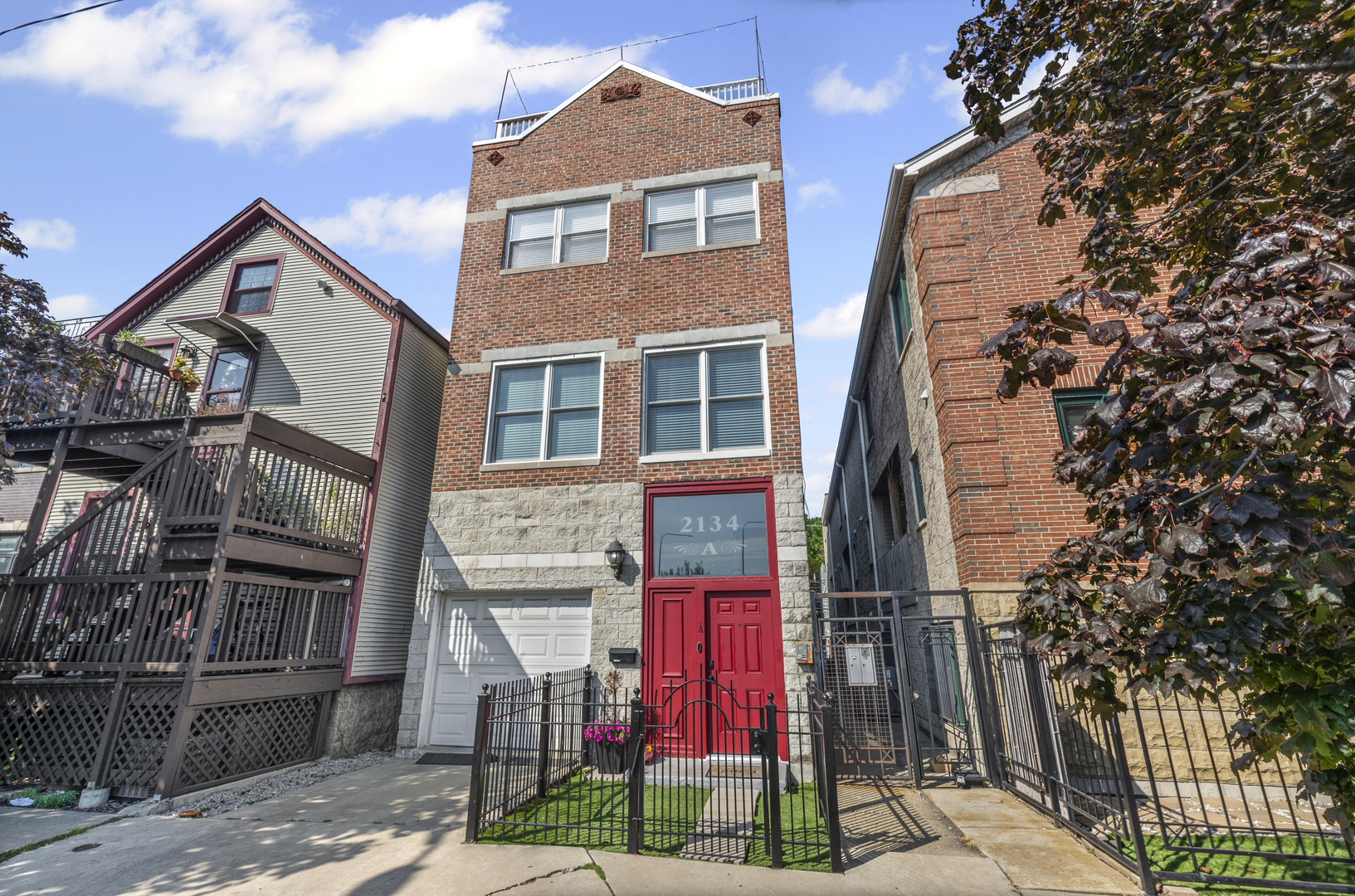 Tucked away on a very quiet Bucktown street, this spacious 3 bedroom, 2.5 bath townhome offers generous living space, thoughtful updates, private attached garage parking, a rooftop deck, and the freedom of fee-simple ownership with no HOA fees or rental restrictions. Three levels of finished living space begin with a welcoming foyer, a large family room with gas fireplace (that works), and a versatile first-floor bedroom complete with a built-in bookcase and Murphy bed-perfect for guests or a quiet home office. The open-concept second floor is designed for today's lifestyle, featuring flexible living and dining areas, a convenient half bath, and a striking NEW kitchen with rich slate-blue cabinetry accented by gold and wood hardware, a farmhouse sink, a new Bosch dishwasher, and a new Samsung Bespoke refrigerator. Upstairs, the primary suite includes a spacious walk-in closet and private en-suite bath, while a bright and airy second bedroom with easy access to another full bath provides comfort and versatility. The rooftop deck delivers sweeping skyline views and is an ideal spot for summer nights with friends, morning coffee, or simply enjoying the city from above. Oak hardwood floors run seamlessly throughout, and every closet is outfitted with custom organizers for maximum storage. A full partially finished basement provides laundry, abundant storage, and endless possibilities for customization, while private garage parking with additional storage completes the home. All this, just steps from the 606 Trail, public transit, Bucktown's celebrated restaurants, nightlife, shops, parks, and Pulaski International Elementary School. Truly a rare find.