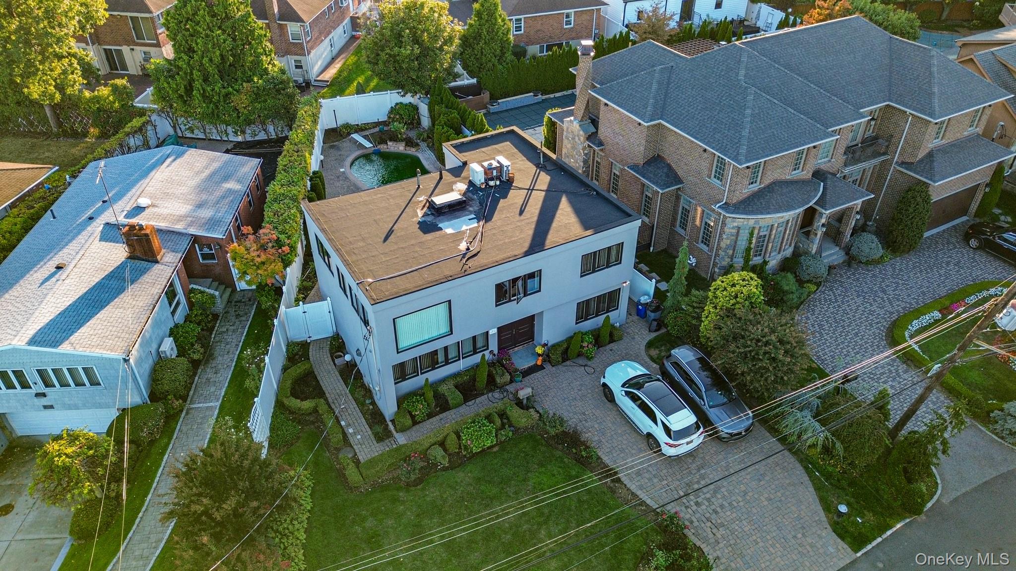 Nestled in one of Whitestone’s most prestigious waterfront communities, 14962 Powells Cove Blvd offers an exceptional lifestyle with stunning water views, exclusive access to a private community beach, and resort-style amenities. This spacious 4-bedroom, 4.5-bath residence showcases elegance and comfort with expansive living areas, large windows that fill the home with natural light, and breathtaking views of the Long Island Sound. The thoughtfully designed layout offers both formal entertaining spaces and cozy family living, with each bedroom featuring its own private bathroom for ultimate convenience and privacy.Step outside to your own private oasis with an in-ground pool surrounded by beautifully landscaped grounds, perfect for summer relaxation and hosting gatherings. This rare offering allows you to enjoy waterfront living with beach access just steps away, while still being minutes from major highways, shopping, top-rated schools, and dining. Whether you’re looking for a luxurious full-time residence or a serene retreat, this remarkable home combines elegance, comfort, and an unparalleled location.