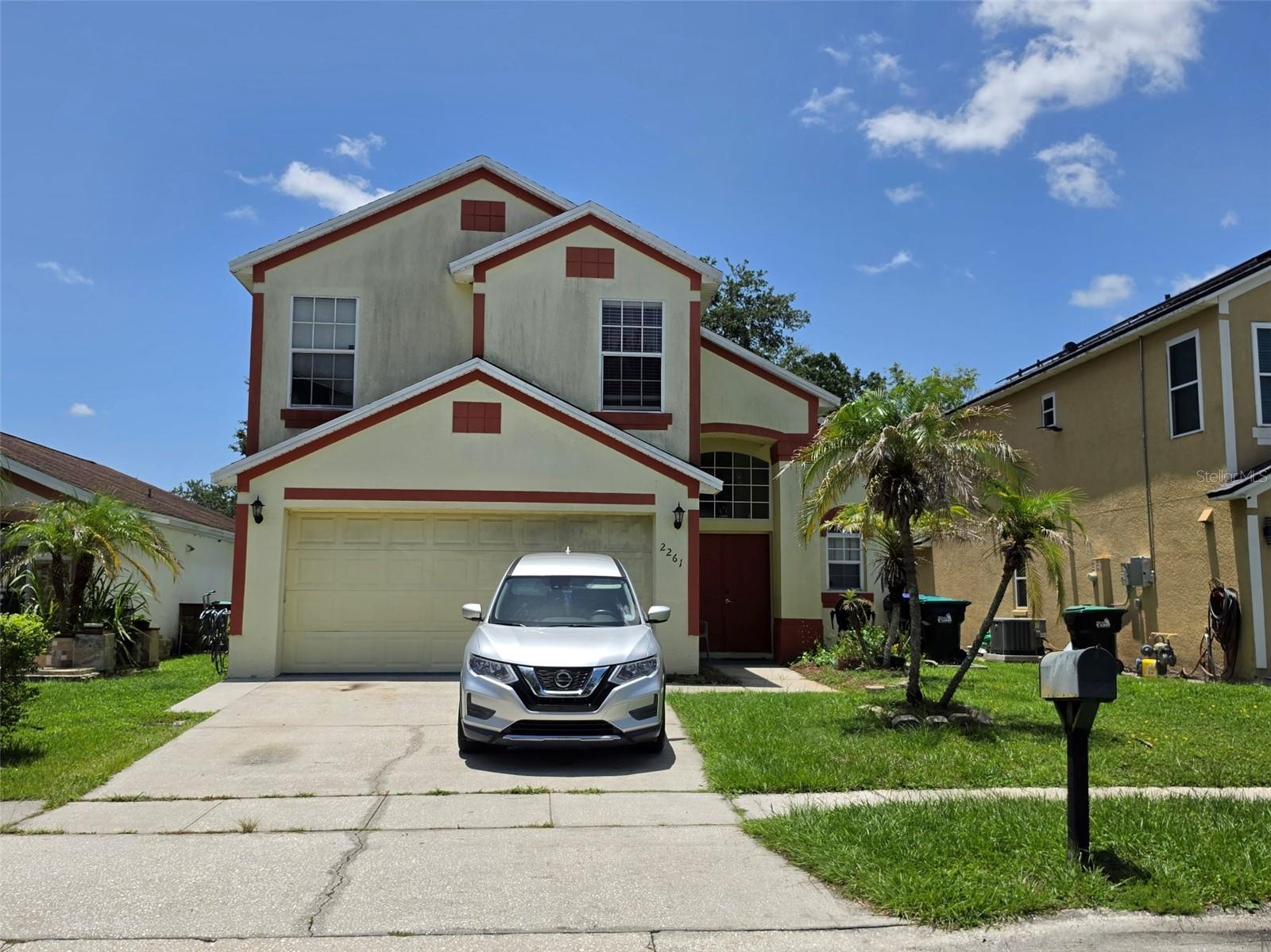 Welcome to this lovely 2-story residence off Central Florida Parkway. This well-loved 4-bedroom, 2.5-bathroom home boasts cathedral ceilings that create an open and airy atmosphere. Enjoy a bright, eat-in kitchen with a stainless steel gas range, perfect for culinary enthusiasts, and a cozy living area ideal for family gatherings. The primary bedroom is conveniently located on the first floor, featuring a dual vanity en suite and a separate water closet for added privacy. Rest easy with a new roof (2017), a modern AC system (2021), and a brand new stainless steel fridge, ensuring your home is as efficient as it is beautiful. Step outside to a large, partially fenced backyard, offering plenty of space for outdoor activities, gardening, or simply relaxing in the Florida sun. Enjoy the convenience of being just minutes away from major attractions and shopping venues, making it easy to enjoy all that Central Florida has to offer. This home is not just a property; it’s a place where memories are made. Don’t miss your chance to make it yours!