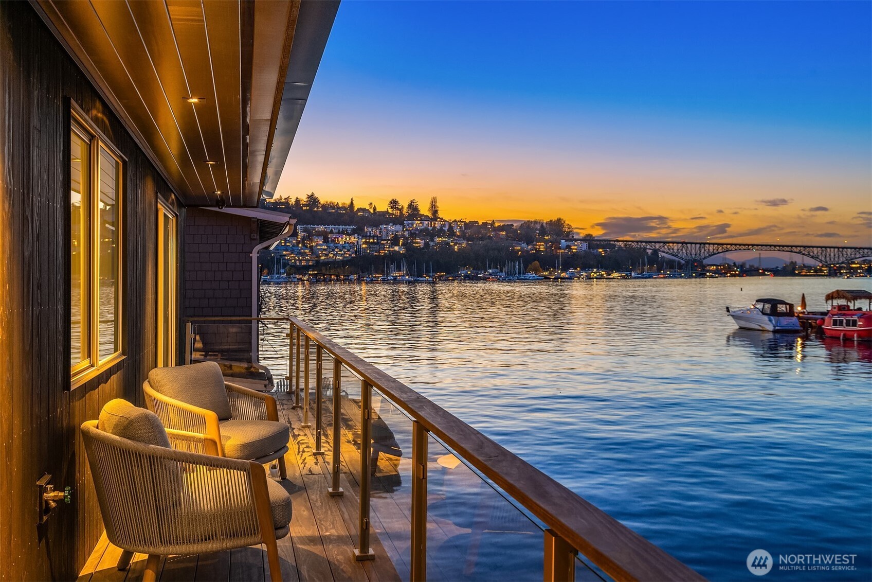 Now available, The Noir House, Seattle’s only Built Green certified floating home - an architecturally iconic Lake Union residence quietly positioned front row in the heart of Eastlake. Clad in striking Shou Sugi Ban siding, this three bedroom, three bath sanctuary offers nearly 2000 sf of refined living designed to connect seamlessly with water, light, and skyline views. Expansive windows invite natural light while thoughtful materials and modern finishes create a warm, sophisticated environment equally suited for quiet mornings or lively gatherings. A spectacular 1000 square foot rooftop terrace captures breathtaking sunrise, city skyline, and lake views and becomes a natural extension of the home, ideal for morning coffee, yoga, sunset soirées, or even a friendly rooftop pickleball rally. Thoughtfully constructed with sustainability in mind, the Built Green certification reflects a commitment to energy efficiency, responsible materials, and lower environmental impact. Additional highlights include single garage parking, easy street parking, and limited side tie moorage suitable for a small whaler runabout or all of your toys. Just moments from Eastlake’s vibrant corridor of cafés, dining, and neighborhood amenities, daily life here is effortlessly walkable while still preserving the tranquility of waterfront living. Floating homes of this architectural caliber and environmental pedigree rarely come available.  Inquire about the possibility of a fully furnished offering.