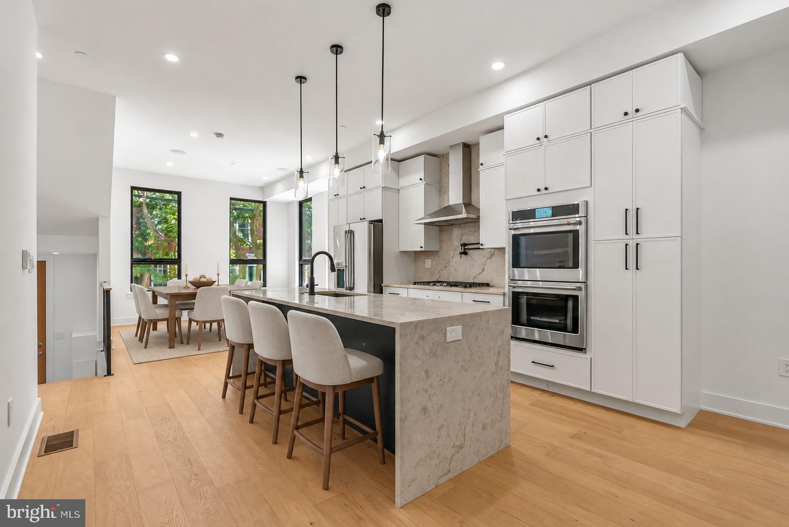 LAST HOME LEFT at Artist Village! Located at the corner of 17th & Bainbridge Streets in the heart of historic Graduate Hospital, this stunning 20-foot-wide residence offers the perfect blend of modern luxury and timeless design PLUS the ORIGINAL ten year tax abatement! Designed by award winning JKRP Architects, the home is thoughtfully laid out to maximize both form and function, with every detail carefully considered. A handsome brick façade welcomes you at the exterior, while inside, the main level opens to a bright living and dining area, filled with natural light from tall windows. The chef’s kitchen is the centerpiece of the home, featuring Beautiful Bosch appliances, custom cabinetry, and designer finishes that make it as functional as it is beautiful. The lower level includes a private two-car garage and a bonus space ideal for a home theater, playroom, or gym. An elevator provides convenient access to all levels. On the second floor, you’ll find two spacious bedrooms, two full bathrooms, and a laundry room. The entire third floor is dedicated to the luxurious primary suite—a private retreat with a sun-filled bedroom, a custom walk-in closet, and a spa-like bathroom with a double vanity, soaking tub, rainfall shower, and water closet. Topping off this home is a spectacular bi-level roof deck. Complete with a wet bar and powder room in the pilot house, it offers expansive outdoor living space and panoramic views of the city—perfect for entertaining or relaxing. This one-of-a-kind residence combines modern smart-home technology, private parking, and elevator convenience, all within one of Philadelphia’s most sought-after neighborhoods.This highly sought-after Graduate Hospital location earns a Walk Score of 97! Nearby, South Street is lined with local restaurants, shops, and markets. Fine dining, luxury shopping, and lively entertainment can be found in neighboring Rittenhouse Sq, plus Target, Sprouts Farmers Market, and Wine & Spirits are less than a 10-minute walk. This central location also provides easy access to Broad St, Washington Ave, Jefferson Hospital, Pennsylvania Hospital, University City, and I-76. Artist Village presents a rare opportunity not to be missed. The time is now to reserve your home, customize your finishes, and plant your roots in Graduate Hospital's next chapter. The top floor flex space can easily be converted into a fourth bedroom; a door can be added for privacy. Association fees, taxes and square footage are the responsibility of the buyer to have verified independently. The PAR Standard Agreement of Sale for New Construction of sale must be used for new construction properties whether completed or not.Listing contains AI enhanced Photos.