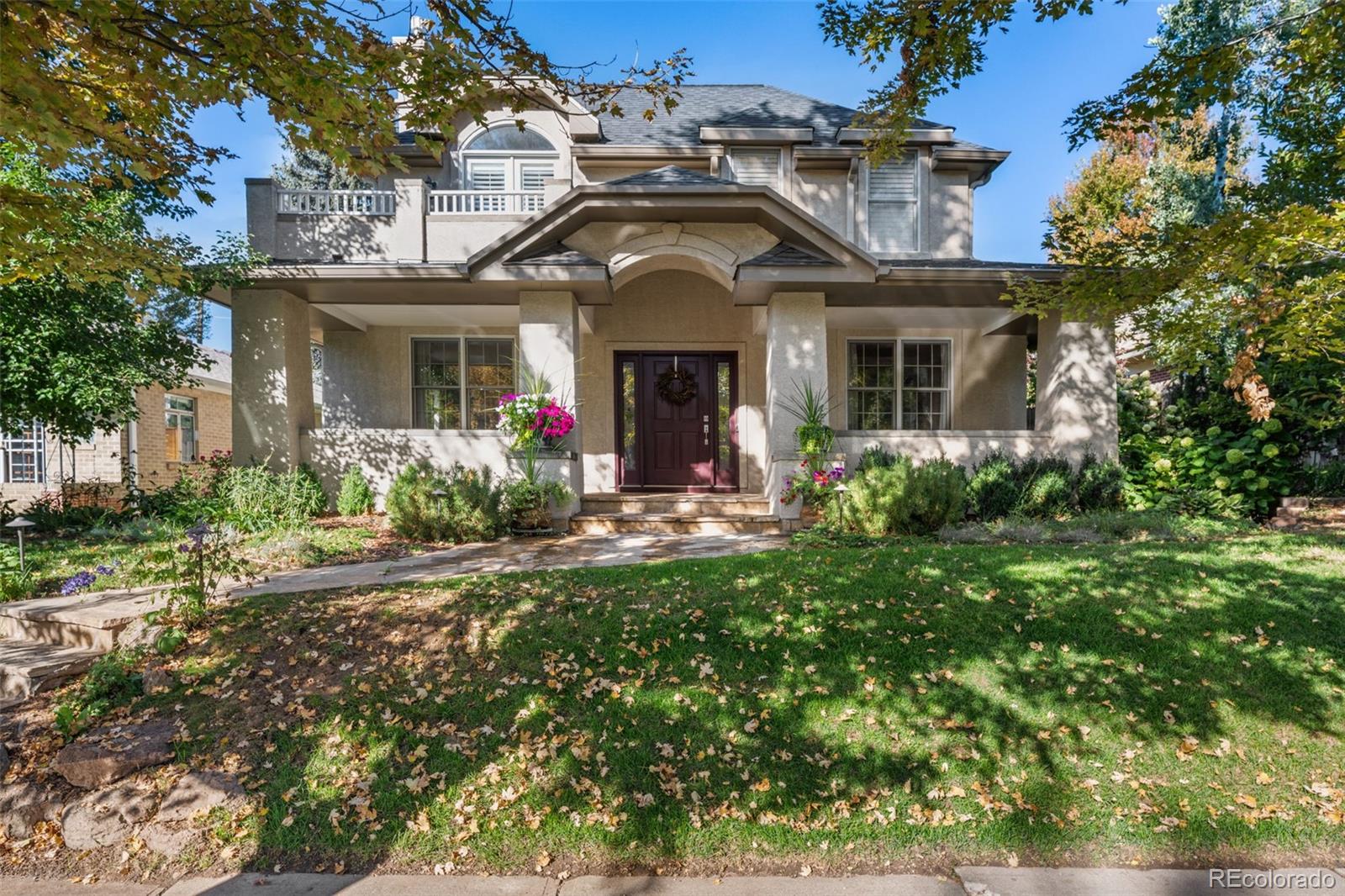 Washington Park East | Elevated Living Just Steps from It All! Perfectly positioned just around the corner from Gaylord Street & only four blocks to Washington Park, this exceptional 5-bedroom, 4-bath residence offers the best of Denver living. Built in 1994 & thoughtfully renovated in 2017, this home blends timeless craftsmanship with modern luxury in one of the city’s most sought-after neighborhoods. Tall ceilings & exquisite architectural details set the tone throughout, including custom built-ins and decorative coffered ceilings rarely found in newer construction. Hardwood floors extend across the main level and stairways, and dual HVAC systems ensure year-round comfort. The gourmet kitchen is designed to impress and perform, featuring a Sub-Zero refrigerator, Wolf range & double ovens, beverage & wine fridge, and microwave drawer. Abundant cabinetry with pull-outs, a butler’s pantry, generous counter space, and a large island make this space as functional as it is beautiful. Enjoy casual dining at the island or breakfast nook, and host memorable gatherings in the formal dining room. The main-floor office offers privacy with pocket doors and convenient access to the backyard patio—ideal for work-from-home flexibility. A marble gas fireplace anchors the elegant formal living room, creating a warm and inviting focal point. The primary suite is a true retreat, complete with a private south-facing balcony overlooking the maturely landscaped backyard. The spa-inspired bathroom features heated floors, a freestanding soaking tub, and dual custom closets. A convenient laundry chute connects directly to the main-floor laundry room. Three additional upper-level bedrooms are generously sized, each with vaulted ceilings and spacious closets. The recreation room is built for entertaining, offering custom built-ins, a wet bar, and flexible space that can easily be expanded by opening the room divider. This home is designed for effortless hosting & comfortable everyday living.