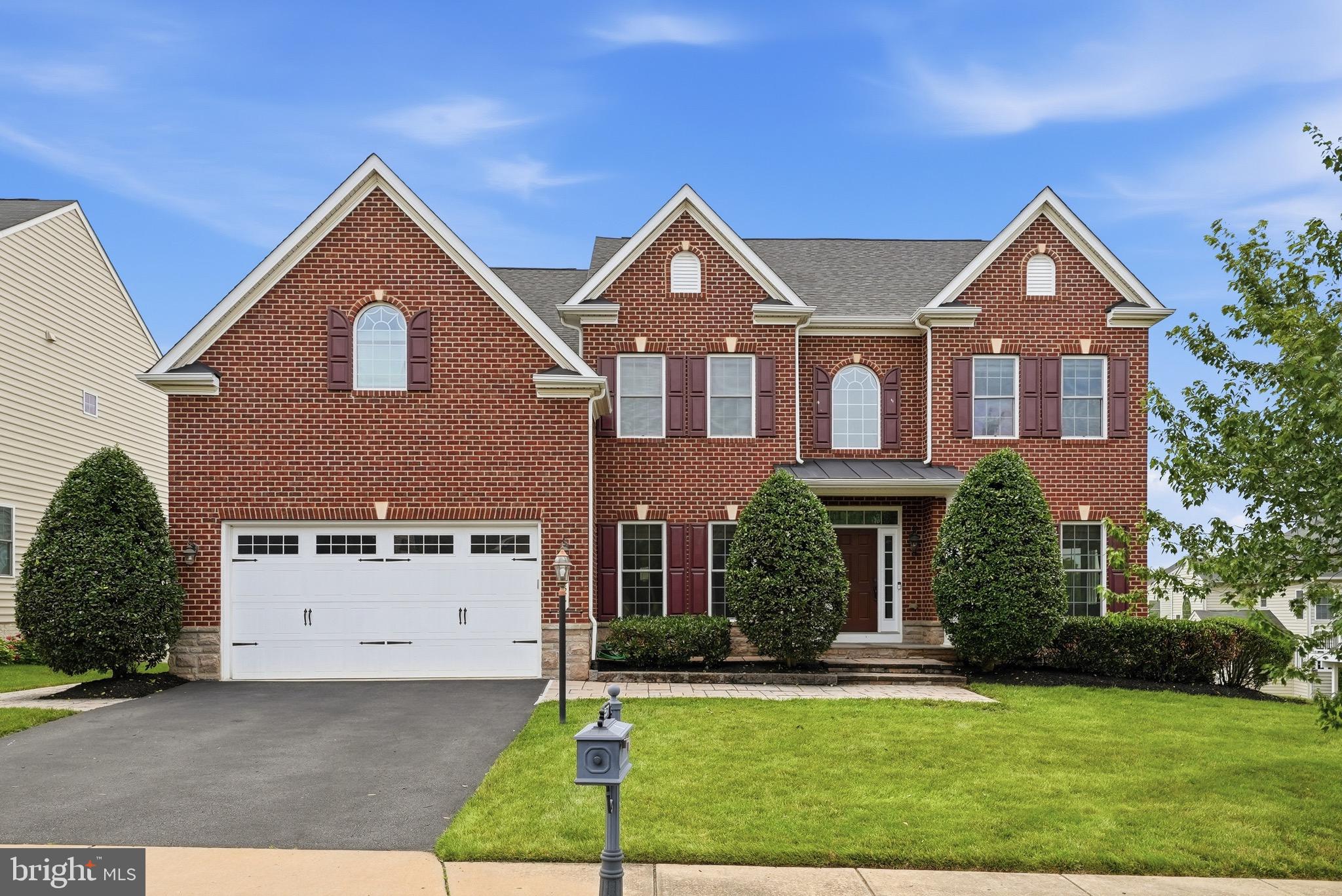 Introducing the former NV MODEL HOME in the highly desirable Seven Hills section of VIRGINIA MANOR—an exceptional Colonial-style home offering 5,908 FINISHED SQUARE FEET across FOUR LEVELS. Lovingly maintained by its original owners, this elegant home blends timeless design with modern comfort in one of Loudoun County's most sought-after communities.Step inside the impressive two-story foyer, where you'll immediately appreciate the FRESH PAINT THROUGHOUT AND HARDWOOD FLOORING ACROSS EVERY LEVEL. The thoughtfully designed floor plan offers FIVE SPACIOUS BEDROOMS, including a PRIVATE TOP FLOOR SUITE, and FIVE-AND-A -HALF BATHROOMS, providing flexibility for today's lifestyle.Designed for both everyday living and effortless entertaining, the main level features a WELCOMING FAMILY ROOM that flows seamlessly into the sun-filled breakfast area and an expansive gourmet kitchen. Complete with granite countertops, TWO DOUBLE OVENS, staineless steel appliances, abundant cabinetry, generous prep space, and a walk-in pantry, the KITCHEN IS FUNCTIONAL AS IT IS BEAUTIFUL.The FULLY FINISHED WALK-OUT LOWER LEVEL is an entertainer's dream, featuring a dedicated theatre room, wet bar, addional dishwasher, full bathroom, versatile flex room ideal for a home office, gym, or hobby space, and an EXPANSIVE RECREATION ROOM with a built-in sound system—perfect for hosting family and friends.Outdoor living is just as inviting, with a low-maintenance deck overlooking a beautifully landscaped, tree-lined backyard. Enjoy evenings around the custom stone patio and fire pit, while the underground irrigation system helps keep the landscaping looking its best.RESIDENTS OF VIRGINIA MANOR ENJOY access to  RESORT STYLE AMENITIES, including pools, community centers, playgrounds, basketball and tenniss courts, fitness center/gym, and scenic walking trails. Conveniently located near major commuter routes, shopping, dining, local wineries, and highly regarded Loudoun County schools, this home offers an exceptional combination of luxury, comfort, and convenience — READY TO WELCOME ITS NEW OWNERS.