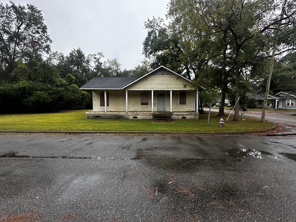 Prime Corner Lot Opportunity – 0.45 Acres Inside City Limits!Attention builders, investors, and visionaries. This property offers incredible potential! Situated on a spacious 0.45-acre corner lot within the city limits, this parcel can be subdivided into multiple lots or used as the perfect site for your new dream home. The existing home on the property provides options such as, renovate and restore it to its former charm or tear down and start fresh with new construction. The level, easily accessible corner lot offers excellent frontage and flexibility for future development. Whether you're an investor looking for your next project, a builder seeking your next development site, or a homeowner ready to create something new, this property is a rare find in a desirable in-town location.