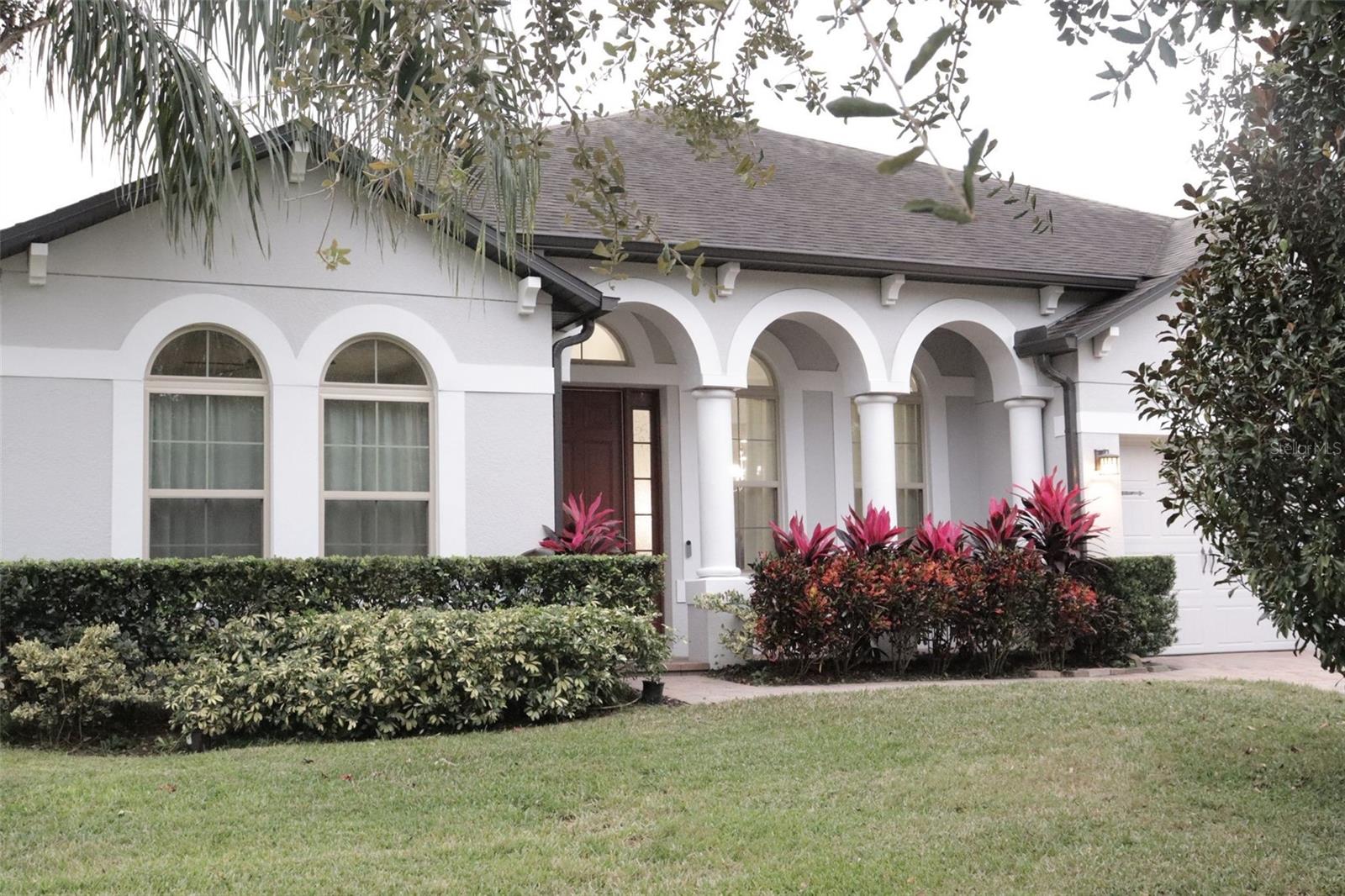 Discover this beautiful residence located in the exclusive community of Fosters Grove in Oviedo. This home offers a modern open-concept design, high ceilings, and spacious living areas that provide both comfort and elegance. The kitchen features quality cabinetry, a central island, and stainless steel appliances, ideal for everyday living and entertaining. The primary suite offers privacy with a contemporary-style bathroom.The large fenced backyard is perfect for family enjoyment and ideal for pets. Excellent location near highly rated schools, shopping, restaurants, and with easy access to major roadways.This property may qualify for financing programs that allow little to no down payment, depending on buyer eligibility. Option available for both FHA and Conventional loans when working with our preferred lender.