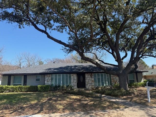 Excellent location in desired Prestonwood & Richardson High School area! Just off Hillcrest on Divided side road. Value priced for a move in ready home with the option to add your personal style in remodeling.  Stunning updates with Stone Rock elevation on front exterior and stacked stone around fireplace.  Beautiful Hardwood floors in dining, formal living area and family room, travertine flooring in wet areas with granite countertops throughout the home. Large covered slate patio with privacy fence, such a beautiful home and great location. A must see!