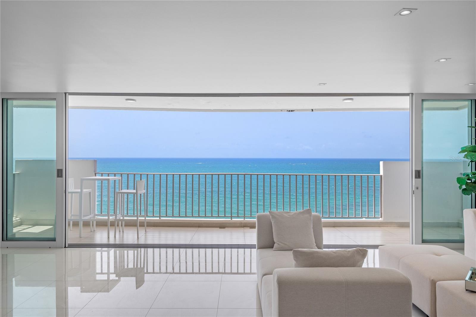 Where the Atlantic becomes your most extraordinary piece of art.Perfectly positioned on the oceanfront, this exceptional residence has been completely reimagined with meticulous attention to detail, creating a home where architecture and the sea exist in perfect harmony. Floor-to-ceiling glass frames breathtaking panoramic views of the Atlantic, allowing the ever-changing horizon to become the centerpiece of every living space.Designed for both sophisticated entertaining and effortless everyday living, the residence features 4 bedrooms, 3 bathrooms, an inviting family room, and 2 parking spaces. Expansive living and dining areas flow seamlessly onto a generous oceanfront terrace, blurring the lines between indoor comfort and outdoor beauty.At the heart of the home is an exquisite Italian-designed Molteni&C and Dada kitchen, thoughtfully appointed with GE Monogram appliances. Clean architectural lines, bespoke finishes, custom lighting, and carefully curated details reflect a timeless aesthetic where form and function exist in perfect balance.Nestled in the quieter oceanfront enclave of Condado, just off Ashford Avenue, this residence offers a rare sense of privacy and tranquility while remaining just moments from the neighborhood’s celebrated restaurants, boutique shopping, cafés, parks, schools, and beaches.Residents enjoy exceptional amenities including 24-hour security, a full backup generator, water cistern, gym, and direct beach access, providing comfort, convenience, and peace of mind year-round.More than a residence, this is a home where exceptional design quietly complements its greatest luxury—the endless Atlantic Ocean.