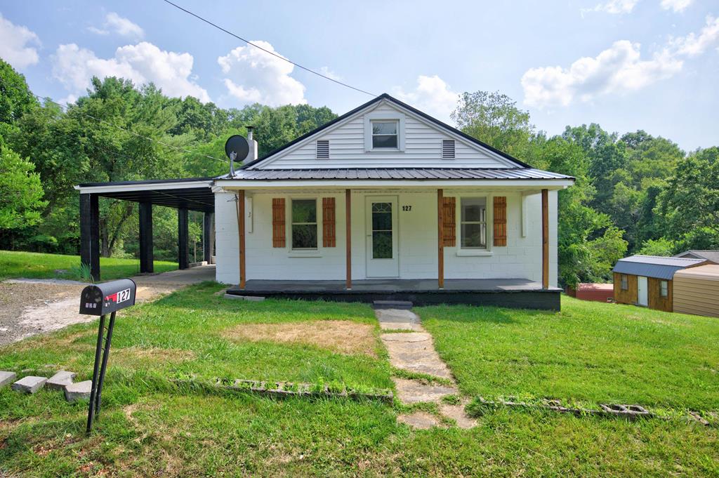 Welcome home to this beautifully remodeled 3-bedroom, 1.5-bath home offering the perfect blend of modern updates and peaceful surroundings. Tucked away as the last home on a quiet street, you'll enjoy the privacy of a country setting while being just minutes from all the conveniences of town.  Inside, you'll find a brand-new kitchen, fresh finishes throughout, and a functional mudroom that adds everyday convenience. The efficient mini-split systems provide year-round comfort, while the thoughtful renovations make this home truly move-in ready. The finished attic provides valuable additional living space and could easily serve as a fourth bedroom, home office, playroom, or bonus room to fit your needs.  Outside, the covered carport offers protected parking, and the property's unique location allows you to enjoy frequent visits from local wildlife right from your own backyard. It's a rare opportunity to experience the tranquility of nature without sacrificing convenience.  Located just 3 minutes from downtown Galax, you'll have quick access to shopping, dining, schools, parks, and local entertainment while still coming home to a peaceful retreat. This property truly offers the best of both worlds—city conveniences with the peaceful feel of country living. Whether you're looking for your first home, room to grow, or a move-in-ready property with flexible living space, this one is a must-see.