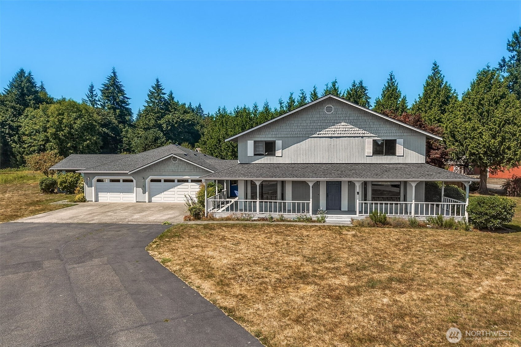Close-in country living with true multi-generational possibilities! Set on a sunny, level 2-acre parcel in coveted South Bay, this unique property offers a shy 5000 SF of total space, barn, outbuilding, individual well & 6-bedroom septic. Main home is approx. 3,200 SF with 4 bedrooms, while the attached 2-bedroom, approx. 1,300 SF family-member suite offers wonderful flexibility. The two spaces are joined by an appx 200 SF mudroom that also connects to the impressive 836 SF 3 car garage. Each residence has its own laundry, water heater, propane tank & gas fireplace; main home also has a wood stove. Recent improvements include an updated kitchen & large 2nd-floor bath, newer roof & recent exterior paint. Spacious primary suite features 2 closets, private bath & slider to upper deck; another upstairs bedroom also enjoys deck access. Sweet wraparound porch & covered rear decks add to the charm. Tucked on a quiet lane, this is one you truly need to see—photos & floor plans simply don't capture all the possibilities! Priced below market to reflect some remaining projects, while many big-ticket improvements are already complete.  Buyer to verify square footage.