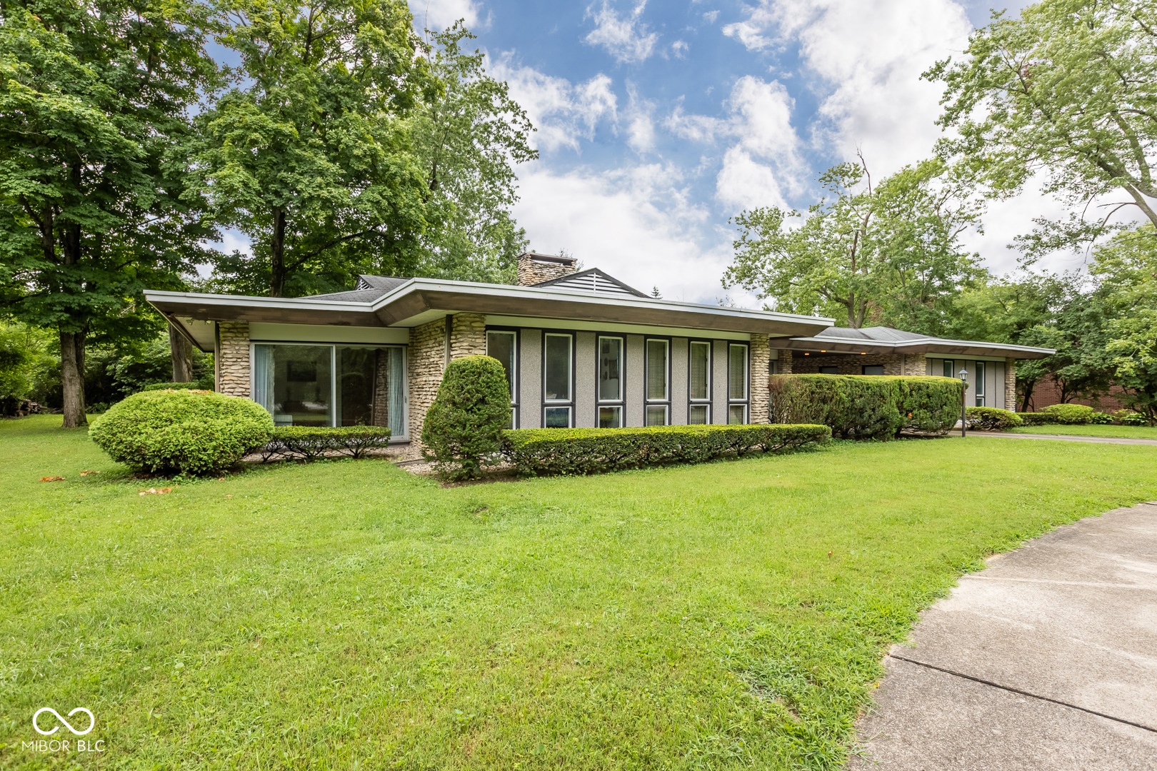 Mid-Century Modern lovers-this one's for you! Originally featured as the show home in the 1960 Indianapolis Home Show, this architectural gem is a rare find. Designed by its original owner, an architect, and lovingly maintained by the same family ever since, the home stands as a beautifully preserved example of timeless mid-century design. Nearly all of the original features remain intact, offering an incredible opportunity to own a true piece of architectural history. Yes, it needs a little TLC-but homes with this pedigree and potential don't come along often. You'll appreciate the spacious rooms, warm and welcoming living spaces, and intuitive flow of the floor plan-all framed by striking exterior stonework and a generous yard. Conveniently located near I-465, schools, and shopping, this one-of-a-kind home is ready for its next steward.