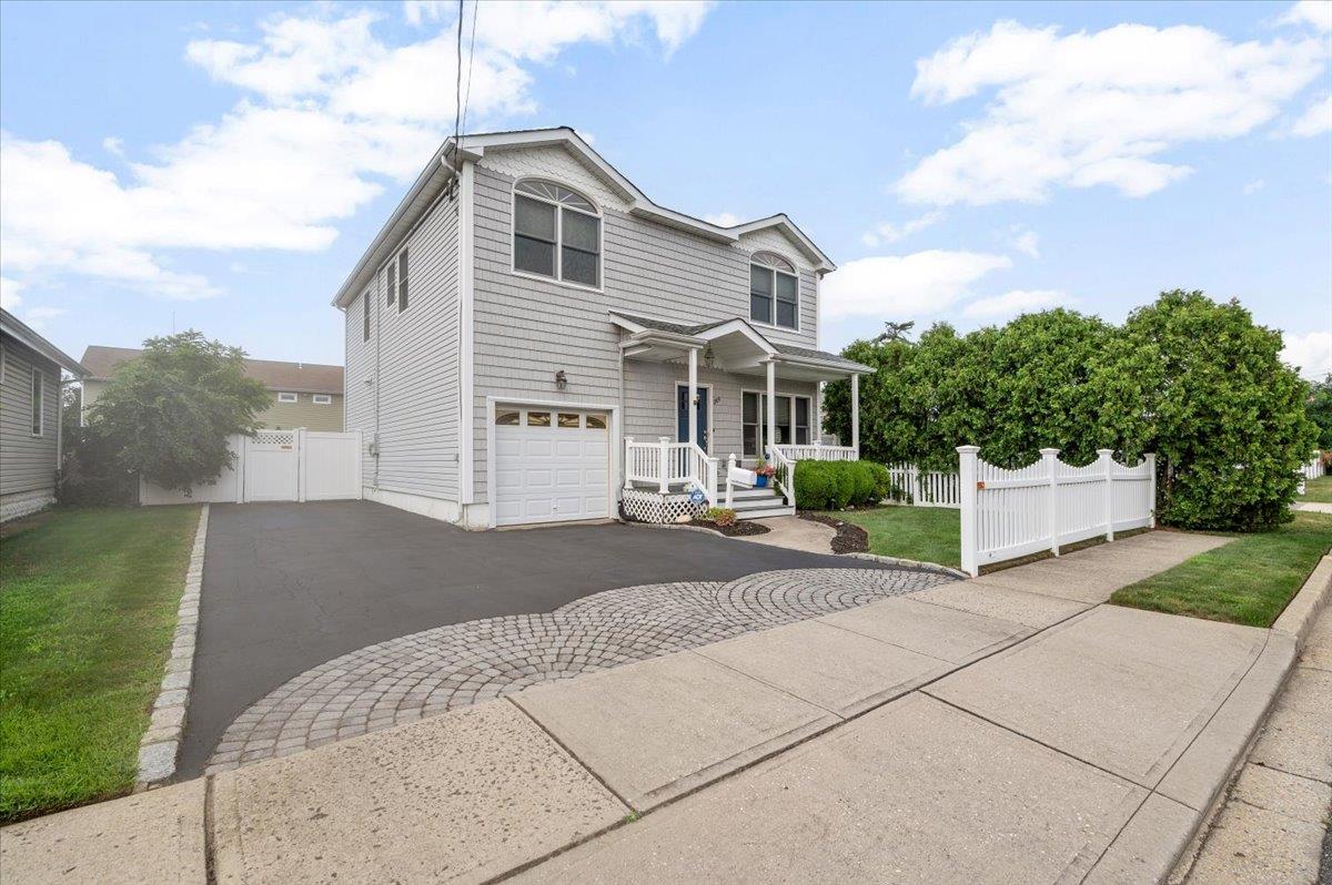 This Home Is a Custom Built 4 Bedroom 2.5 Bath Colonial. The HOME Features 9 Foot Ceilings on the FIRST Floor Which Lend to The Spacious Feeling. The Home Features Hardwood Floors Throughout most of the House. The Living room Offers a Double Deep and Wide Entry Closets. Stainless Steel Appliances can be found in the Kitchen, Which includes GAS COOKING, Wood Cabinets, Lengthy Counter That Extends To A  Peninsula with Seating. There is Separate But Open Large Formal Dining Room Space, Sliding Glass Doors provide Convenient Access to the Rear Yard. Half a Bath Also Located On This Level.
The 2nd Level Features Your Primary Bedroom, Which Is King Size, With a Full Private, Four Piece Bathroom Jacuzzi Tub, Walk-In Shower And Double Sink. 3 Queen Size Bedrooms, Can Be Seen. There is a Full Bath With the Tub Off the Hallway. Additional Pull-Down Stairs For Attic Storage, Which Has A Solar Powered Fan.
The House Has a Full Basement with an Outside Entrance Which Is Finished With a Separate Laundry Room and Utility Closet and Plenty on STORAGE
There is a One Car Attached Garage With Heat. Full Fenced Private Yard with Mature Shrubs' to provide Privacy, Paver Patio and also Your Own Front Porch Walking Distance to All
A Lovely Fenced In Rear Yard With Mature Plantings The Provide Privacy. 
All Conveniently Located in the Hamlet of Bethpage, Walking Distance To All.