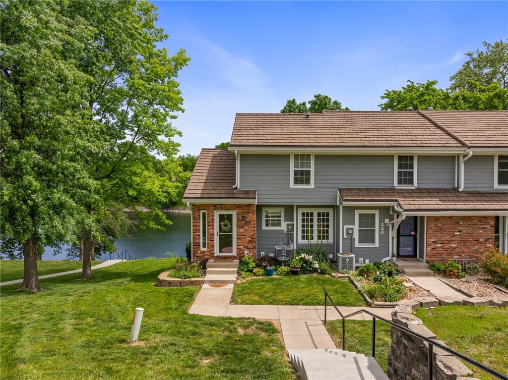 If you've been dreaming of maintenance-free lakefront living, this one's for you! Nestled on one of the most coveted shorelines in Lakewood, this rare lakefront townhome offers unbeatable views—including front-row seats to the best fireworks show on the lake! Just steps from the private swim dock, this home brings the lake lifestyle right to your back door where everyday living feels like a vacation.

Enjoy your morning coffee or evening wine with multiple scenic decks overlooking the water. Inside, you'll find a fully remodeled kitchen featuring sleek finishes and modern functionality, paired with gorgeous engineered hardwood floors throughout the main level you'll love everyday in your cozy retreat. Upstairs offers two spacious bedrooms including the primary suite with its on private balcony for relaxing morning views.  Downstairs the walkout basement provides easy access to your patio—perfect for keeping your kayak ready for the next adventure or storing your fishing gear for that mid morning cast. This home comes with its own detached garage—a rare perk in Bayview, where most lease theirs. An additional bonus is the extended 2 year home warranty that you'll inherit adding to the ease and worry free homeownership.

The Bayview HOA covers exterior maintenance, roof, siding, property insurance, lawn care, snow removal & trash—giving you more time to enjoy all Lakewood has to offer: golf course, multiple pools, walking trails, sport courts, and endless days on the water fishing, kayaking, or taking the pontoon out for a stroll. There's nothing more you need to do on this one but move in! Welcome home!