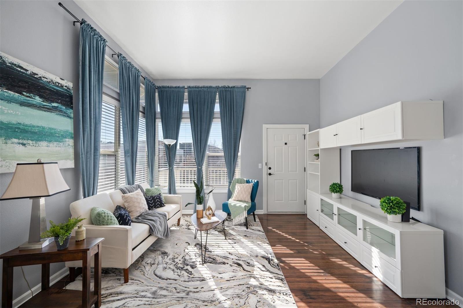 Welcome to this modern, second-level corner unit in the heart of Central Park, offering abundant natural light, high ceilings and no one living above you! The open living area flows seamlessly into a functional kitchen with ample storage and space for a dining table. Step outside to your large west-facing patio, perfect for grilling, entertaining or enjoying Colorado sunsets. The home also features a dedicated in-unit laundry closet with washer and dryer included. The versatile second bedroom includes a built-in Murphy bed, ideal for guests or a home office, while custom living room shelving and built-ins are included for added style and functionality. Enjoy easy access to Central Park’s pocket parks and the popular Aviator Park Pool, all included through the community association, making this a low-maintenance, high-lifestyle opportunity in one of Denver’s most sought-after neighborhoods. Hang on your deck this summer or walk two blocks to the East 29th Avenue Town Center for workouts at Pure Barre, Coffee at Etai’s Bakery or margaritas and tacos at Lady Nomada!