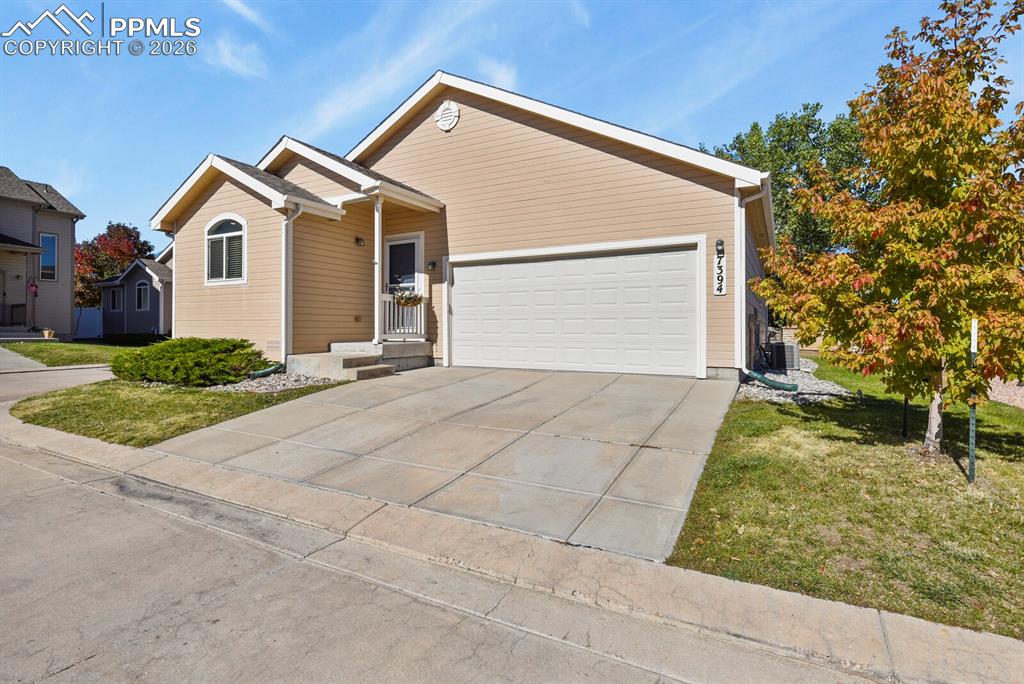 Cozy and welcoming, this three-bedroom ranch-style home is nestled in a quaint, low-maintenance community in the heart of Falcon. The open and airy main level offers effortless one-level living, with all amenities conveniently located on the same floor—including laundry and direct garage access.Luxury vinyl plank flooring runs throughout the main living areas, while carpet adds comfort to each bedroom. The kitchen comes fully equipped, and the washer and dryer are included, making this home truly move-in ready.Downstairs, the unfinished basement provides a blank canvas with endless potential—perfect for future expansion, storage, or a personalized retreat. Enjoy the benefits of a walkable neighborhood just moments from restaurants and shopping, with a community park and access to scenic walking trail.