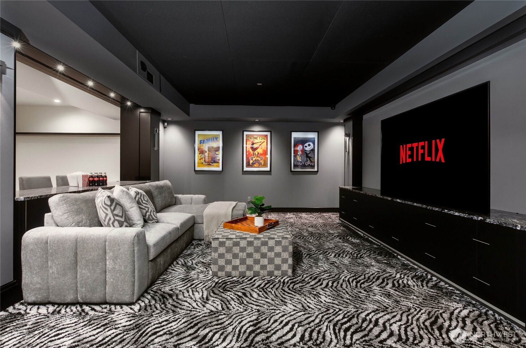 Lower-level media room and entertaining spaces designed for movie nights and gathering with friends and family.