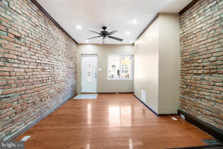 Embrace upscale urban living in this newly renovated 4-bedroom, 3.5-bathroom residence nestled in the historic district of Harbor East. This stunning home offers a perfect blend of elegance, comfort, and convenience. Step inside to discover a spacious and light-filled interior adorned with modern finishes and designer touches throughout. The living area is perfect for entertaining, featuring gleaming hardwood floors, recessed lighting and large windows that allow in plenty of natural light! The newly renovated kitchen boasts stainless steel appliances, granite countertops, and ample cabinet space. Enjoy casual meals at the dedicated dining room space. Two bedrooms share a bathroom on the 3rd floor while the other two bedrooms have their own private bathrooms with a half bath on the primary level for guests - a perfect layout for family or roommates! Outside, a private backyard provides the perfect spot to unwind. Located within walking distance to dozens of restaurants and the iconic Harbor East & Inner Harbor, residents will enjoy easy access to the city's best dining, shopping, and entertainment options. Plus, it's just a twenty-minute walk (or a quick 5-minute bike ride) to Johns Hopkins Hospital, making it convenient for healthcare professionals. Whole Foods is also within walking distance, providing easy access to fresh groceries and gourmet treats. Additionally, the Johns Hopkins Carey School of Business is only a 10-minute walk away. Please contact alt agent with any questions or concerns -