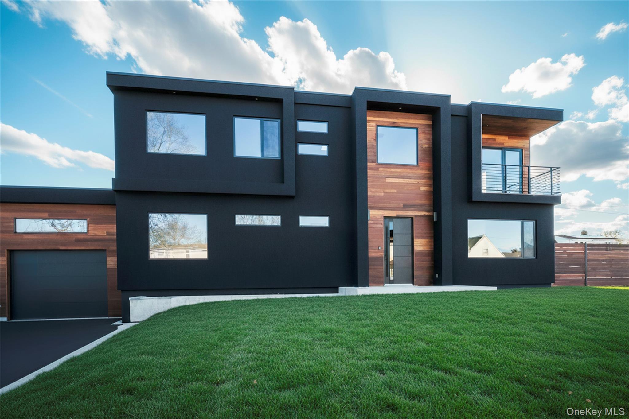 Discover an architectural masterpiece where modern contemporary design meets luxury living. This newly constructed 4-bedroom, 3.5-bath home showcases a rare blend of striking aesthetics, exceptional craftsmanship, and intelligent functionality. This home offers open-concept layout that emphasizes space, comfort, and seamless flow, High 9-ft ceilings create a grand atmosphere, while European windows feature advanced technology bathe the home in natural light. Designer lighting, and natural stone elements complement the home’s sharp, clean architectural lines. Gourmet Kitchen features quartz countertops and a seamless connection to the dining and living areas, a sleek electric fireplace adds warmth and ambiance with the touch of a button. Main floor continues with a private Guest Suite, dedicated Office Room, Laundry Room and a Pantry. Upper floor includes 3 spacious bedrooms with custom closets and 2 full spa-style Bathrooms and a Balcony. The home’s sophistication continues outdoors with modern fencing, a paved patio, and a full irrigation system. Located just 10 minutes from the LIRR train station, this home offers an ideal balance of luxury and convenience. With the unique designer's attention to detail, this stunning home is truly impossible to miss.