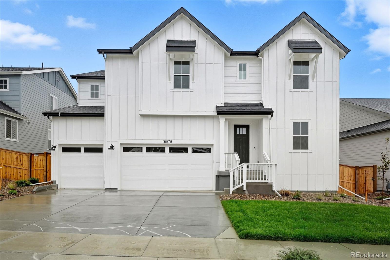 New Construction - Ready Now! Built by America's Most Trusted Homebuilder. Welcome to the Vail at 16575 W 93rd Place in Trailstone's Destination Collection! This stunning new home blends style and functionality, featuring a dramatic great room with soaring ceilings and a modern fireplace, a cozy hearth room with a double-sided fireplace, and an expansive kitchen with a large island perfect for entertaining. Upstairs offers three secondary bedrooms, two full baths, a convenient laundry room, and a luxurious primary suite with dual closets and a spa-like en-suite. A covered patio and unfinished basement add even more flexibility and value. Located in Trailstone, residents enjoy unbeatable value with low HOA dues, breathtaking views of downtown Denver and the Rockies, and access to top-rated Jefferson County schools. Commuting is a breeze with proximity to major highways, light rail, and business hubs like Interlocken and downtown Denver. The community features a planned 5-acre amenity center with a pool, pickleball courts, an amphitheater, trails, five connected parks, a dog park, and a certified Pollinator Garden. With over seven miles of scenic trails and nearby shopping, dining, and recreation, Trailstone offers the best of Colorado living. Additional Highlights Include: Fireplace at gathering room, hearth room in place of playroom, standalone tub and shower at primary suite, and covered patio. Photos are for representative purposes only. MLS#5607872