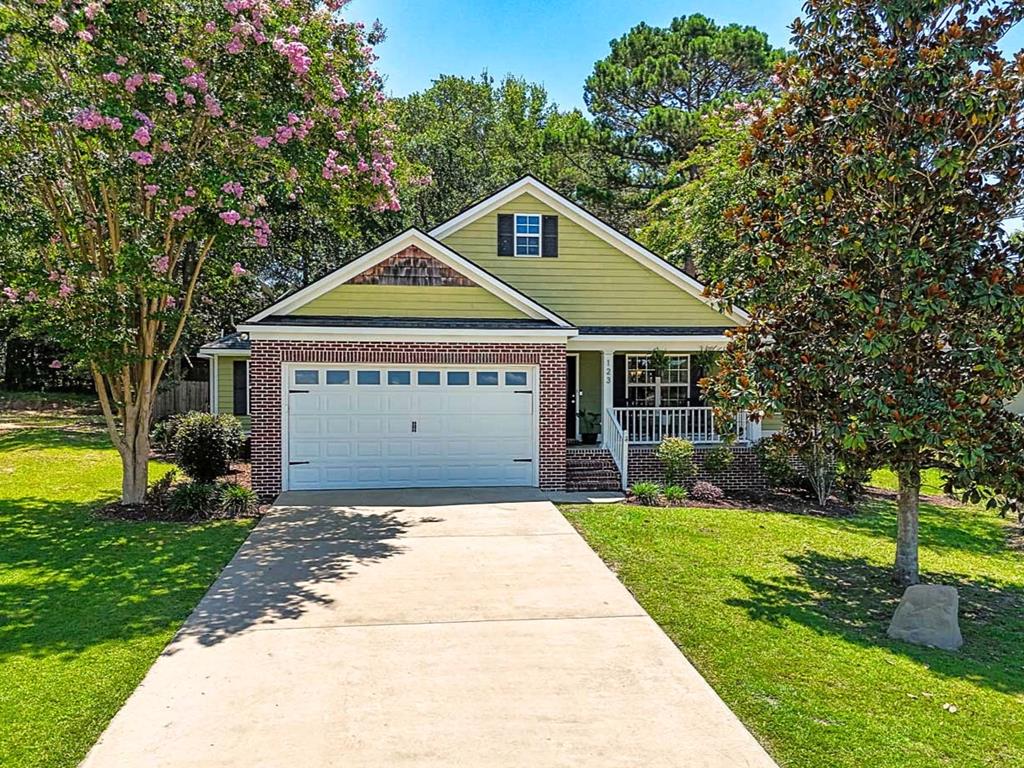 Nestled on a quiet cul-de-sac in the established neighborhood of Jordan Oaks, this 3-bedroom, 2-bath home offers everything you need and more! The inviting open floor plan features soaring ceilings, creating a bright and airy feel throughout the main living area. The kitchen offers a built-in desk area and plenty of pantry space, while a full laundry room adds everyday convenience. The primary suite features its own access to the screened porch, and the primary bathroom offers both a separate shower and soaking tub for relaxing. Two walk-in closets in the primary provide a rare amount of storage for a home of this size. Enjoy your morning coffee on the welcoming front porch or unwind on the screened porch overlooking the quiet, fully fenced backyard. A two-car garage adds even more convenience, while county taxes only make this home even more appealing. This one is a must-see!