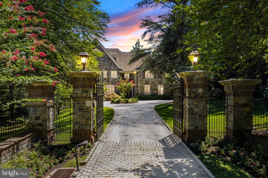 Nestled behind a gated entrance in Gladwyne’s prestigious estate section, 1045 Waverly Road is a breathtaking stone manor home crafted by renowned builder William Smith. Designed to transcend time and style, this 7+bedroom, nine full and three half-bath European-inspired estate offers over 15,000 square feet of exquisitely finished living space across four bespoke levels. 4 car oversized garage with motor courtyard. Set on 1.5 lush, private acres just moments from the Village of Gladwyne, this home is a rare fusion of old-world craftsmanship and modern luxury. Soaring 10+ foot ceilings on the main and lower levels create a sense of grandeur, enhanced by oversized windows that flood each space with natural light. At the heart of the home lies a spectacular chef’s kitchen with dual marble slab countertops, a double Viking range, full refrigerator and freezer, and an oversized island.  This stunning space opens to a full bar nestled within the Great Room with soaring 20+ foot ceilings further enhanced by one of six stone gas fireplaces. Primary Suite offers a Sitting Room, bedroom with fireplace, private terrace, lounge, Yours & Mine Bathrooms, and closets, Dressing room along with a coffee bar. Each additional spacious bedroom features it's own marble ensuite bathroom and walk-in closet. The fully finished walk-out lower level surrounded by windows from nearly every angle, is a destination of its own, with radiant heated honed marble flooring throughout. Here you will find a billiard room, family room, lounge, sauna and steam room, wine cellar and tasting room, caterer’s kitchen, Playroom and Gym. A full elevator services all levels, ensuring ease and accessibility throughout. Outdoors you will find a several bluestone patios surrounding the resort-style pool and spa, offering tranquil views of the surrounding natural beauty and mature landscaping. This is Main Line living at its most refined — masterfully crafted, pristinely maintained, and exceptionally styled. A home that honors tradition while embracing luxury, 1045 Waverly Road is a once-in-a-generation offering.