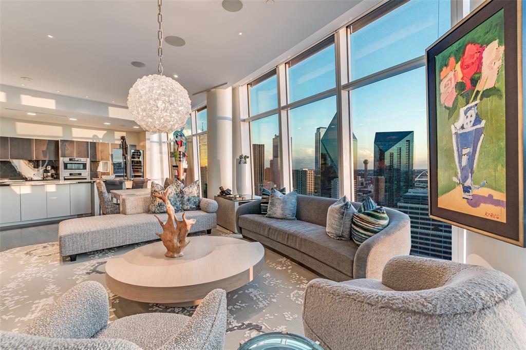 A rare opportunity, this north-facing Home 2401 at Museum Tower offers 3,745 square feet of refined living with panoramic views framed by floor-to-ceiling windows fitted with motorized shades. Venetian plaster walls in the entry set the tone for timeless sophistication.

The open floor plan connects expansive living and dining areas to a chef-inspired kitchen showcasing a custom island with Basalt counters, Miele appliances including a gas cooktop, warming drawer, and dual wine refrigerators and deep drawers with a custom organization system. The butler’s pantry elevates entertaining with stainless steel backsplash, additional prep space, Miele ice maker, and professional dishwasher. Majestic views of the iconic Dallas skyline, Klyde Warren Park, Uptown and the Dallas Arts District make every room a sight to be seen.

A spacious sky room with integrated entertainment system creates an additional retreat for gatherings. The serene primary suite offers a walk-in Poliform closet and spa-like bath with heated floors, while the secondary suite provides equal comfort. Outdoors, a private terrace finished in limestone tile with pet guard extends the living space. Museum Tower curated services-amenities: 24-7 concierge-valet, 80-ft pool, great lawn, fitness room, saunas, guest suites, dog parks and more. World-class dining, shopping and entertainment promise an enriching urban experience.