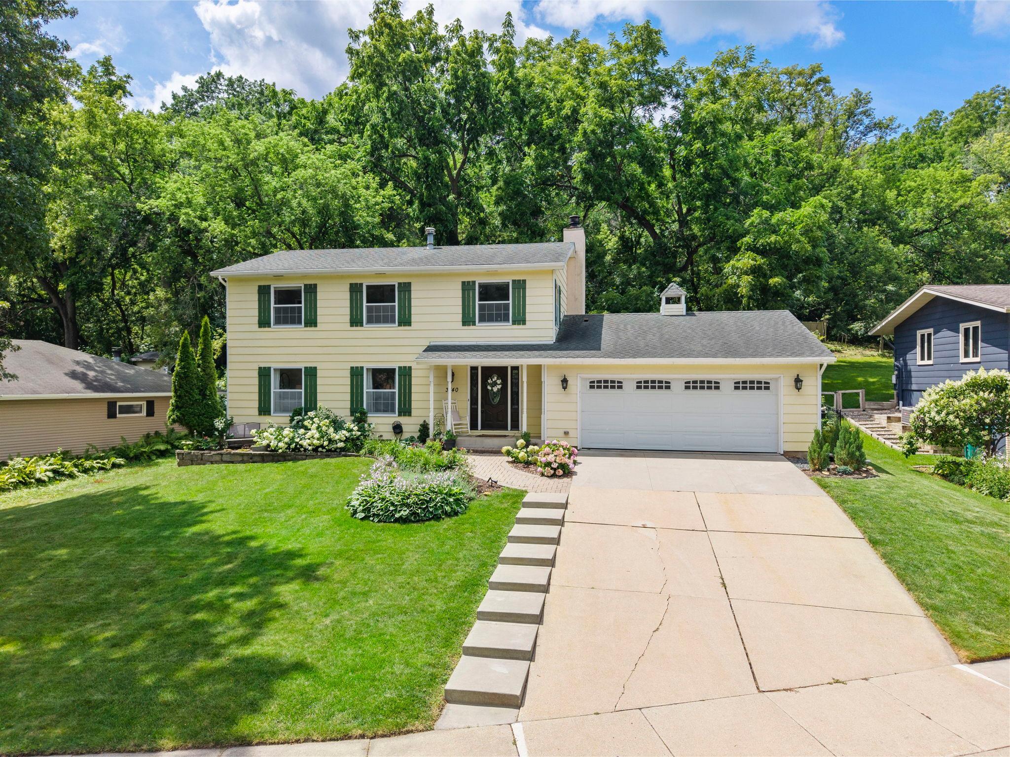 Hidden at the end of a quiet cul-de-sac, this character-filled 5-bedroom, 3-bathroom home offers the perfect blend of generous living space, timeless charm, and an incredible backyard retreat.Surrounded by mature trees and established landscaping, the setting feels peaceful and private while remaining just minutes from Rochester Golf & Country Club, Cascade Creek, parks, lakes, shopping, and local schools.Inside, hardwood floors, oversized windows, two cozy fireplaces, and multiple gathering spaces create a warm, welcoming atmosphere designed for both everyday living and entertaining. The heated, oversized 26x24 garage adds flexibility with built-in shelving and room for storage or projects.A rare upper-level layout places all five bedrooms together, including a spacious primary suite with a walk-in closet, private bath, and balcony overlooking nothing but trees and green space. Outside is where this home truly shines. The fully fenced, tiered backyard feels like your own private park, complete with an expansive patio, deck, raspberry bushes, and frequent visits from wildlife.Whether hosting summer gatherings, enjoying a quiet morning on the front patio, or simply appreciating the peaceful surroundings, this is the kind of home and outdoor space that's becoming hard to find.