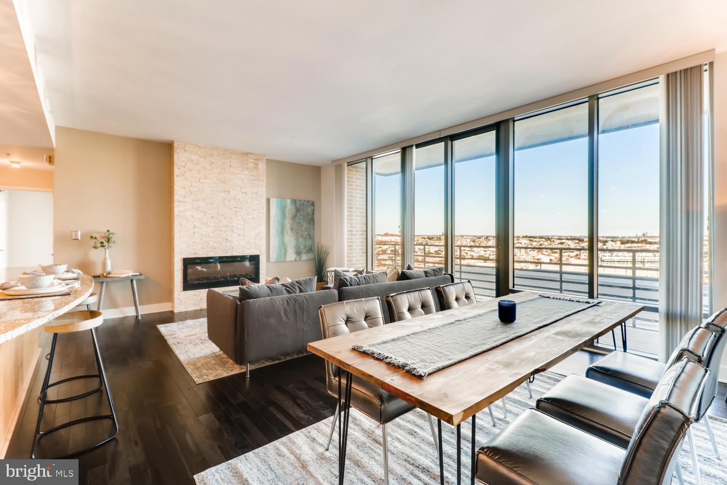 Stunning corner two bedroom, two bath Harbor East residence at The Vue condominium.  This residence features panoramic city views from every room, an open floor plan with floor-to-ceiling windows, gourmet kitchen, expansive kitchen island, custom stone fireplace, new rich hardwood flooring and private balcony. The primary suite features dramatic city and water views, spacious walk-in closet and an en-suite primary bathroom with granite double vanity, walk-in shower and soaking tub. One covered parking space is included with this offering. The Vue is a full-service condominium located in the heart of Harbor East steps to the finest restaurants, boutique shops, Whole Foods, Starbucks, Landmark Theater, Inner Harbor, waterfront and nightlife. Convenient access to I-83.