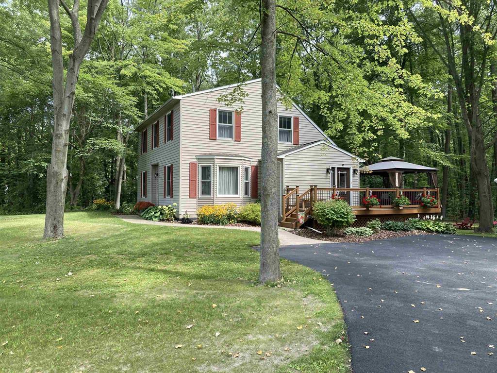 "Elegantly Crafted Saltbox" You'll love coming home to this beautifully appointed Retreat. It's what's referred to as a "Lifestyle Property". It's perfect for the season's of your life! Whether you are a younger family with children or empty nesters, it works! It's appointed with 3 spacious upper story bedrooms, of course you'll find the primary, on suite and walk-in. Gorgeous formal Entry with sweeping Staircase welcomes you into the main level, into the spacious Living room and thru to the Formal dining. The Kitchen has an island bar with an eat-in area that transitions into the side entrance and separate laundry. Don't miss the main level Music room, with French door! And that's not all! The lower level is perfect for family game nights or the home theater experience. Theres plenty of storage, and a separate exercise room. The mechanicals of the home are contained to their own area including a entire home generator system. The exterior is equally as lovely, large back deck for entertaining. Built in gazebo, looking into the beautiful woodlands. Complete new roof in 12/25, which includes a transferrable 15-year warranty. New hot water heater and dishwasher also installed in 12/25.