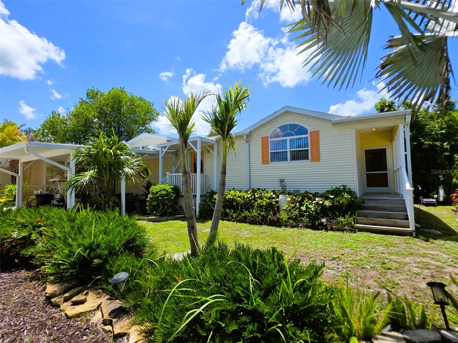 OWNER FINANCING AVAILABLE for this gorgeous remodeled/updated single-family home in the gated nudist/clothing-optional community of Paradise Lakes. This lovely residence is an entertainer's delight, offering a light and bright open floorplan with 3-bedrooms and 2-full baths. The kitchen features new cabinets, granite counters, stainless appliances, propane gas range, built-in microwave, disposal, dishwasher, undermount sink, and closet pantry. An expansive island has a granite counter, breakfast bar seating, and cabinet storage. Spread out in the spacious living room with stone-face wood-burning fireplace and clerestory windows. A dedicated dining area accommodates a table, chairs, and buffet. The primary bedroom suite has a large walk-in closet, dual sink vanity, walk-in tile-surround shower with glass doors, and linen storage cabinets. Two additional bedrooms (one with an exit door to the lanai) are ideal for guests, office, or flex room. Separate laundry room with full-size washer/dryer on pedestals, folding counter, and upper/lower cabinets. Newer AC dated 2020. Sliding doors from the living room lead to the 312 sq ft covered enclosed lanai with laminate flooring, ceiling fan, window AC, and exit to the rear yard featuring a covered concrete paver patio with plenty of seating. Additional highlights include an above-ground heated spa with waterfall faucet, outdoor shower, outdoor custom kitchen with stainless appliances, 4-burner propane range, grill, and cabinets. Create an inviting atmosphere with the propane outdoor fireplace. Need more storage? An 11’ x 12’ site-built TuffShed and additional plastic storage shed can handle all the extras.This beautiful home has neutral carpet/wood laminate/tile/colors throughout, vaulted tray/coffered ceilings, crown molding, and ceiling fans. The covered carport and driveway provide off-street parking. Appliances and most furnishings/decor included.Buyer is responsible for verifying all information, details and dimensions. Condo association approval of Buyer is required including application, fee, background check, orientation, and membership in a recognized nudist organization. Optional membership to Paradise Lakes Resort is not included in monthly condo association fee.