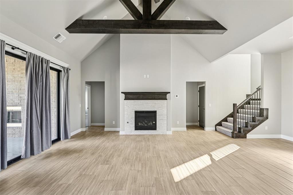 Welcome to the stunning Zade Bonus Room floor plan, offering 3,105 square feet of total living space — including 2,850 square feet indoors and 255 square feet of outdoor living. Perfectly situated in a quiet cul-de-sac and next to a beautiful open park area, this home also features a fully fenced backyard, providing privacy, safety, and a great space for pets or play.Inside, you’ll find 4 spacious bedrooms, 3 full bathrooms, a large bonus room, a utility room, a mudroom, and a 3-car garage complete with an in-ground storm shelter.The inviting great room showcases elegant wood-look tile flooring, a striking cathedral ceiling with crows foot detail, a ceiling fan, and a 3-panel sliding glass door that opens to an extended covered patio. The chef’s kitchen is a showstopper with stainless steel appliances, including a 5-burner gas cooktop and double ovens, 3 cm countertops, tall custom cabinetry with glass inserts and lighting, a decorative tile backsplash, exclusive pendant lighting, and a large center island featuring a farmhouse sink, dishwasher, and pull-out trash can.The primary suite is a true retreat with a sloped ceiling, cozy carpet, and abundant natural light. The spa-inspired bathroom offers a freestanding tub, a European walk-in shower, dual vanities with framed mirrors, and a massive walk-in closet with direct access to the laundry room. Secondary bedrooms also feature high ceilings, ceiling fans, and spacious closets.Step outside to a covered back patio designed for entertaining, complete with a wood-burning fireplace, gas line, and TV hookup — all overlooking the fully fenced yard and open park space behind. Additional features include Healthy Home Technology, a tankless water heater, whole-home air filtration system, R-44 insulation, Cat6 wiring, rocker switches, and more .