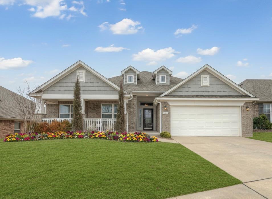 Welcome to this stunning 4-bedroom, 2-bathroom home that truly checks every box. With picture-perfect curb appeal, upgraded landscaping, and a front porch straight out of the movies, this property is as inviting on the outside as it is inside. Step through the upgraded glass storm door and into a bright, open-concept floor plan. The spacious living room features tall ceilings, an abundance of natural light, and a grand tiled fireplace with a wood mantle casing that serves as the heart of the home. The chef’s kitchen is a dream come true with a large island, quartz countertops, plentiful white cabinetry, built-in stainless steel appliances, recently updated dishwasher, and a walk-in pantry. Ceiling fans with remotes have been thoughtfully installed throughout the home for comfort and convenience. The primary suite, tucked privately at the back of the home, is filled with natural light and offers a spa-like retreat. The en-suite bathroom boasts decorative tile floors, dual vanities, a soaking tub, a walk-in shower, and a large wraparound closet. Three additional spacious bedrooms are located at the front of the home, each with generous closets and access to a full bathroom with double vanities. A mud-bench off the laundry room adds practical style. Step outside to your very own outdoor oasis. The extended covered patio offers an impressive 350 sq/ft of outdoor living space with an added 8’ depth and 20’ width, complete with a custom wooden pergola—perfect for entertaining or relaxing. The manicured backyard features upgraded landscaping, stone pathways, a sprinkler system, and an 8’ x 12’ outbuilding for extra storage. Additional upgrades include: Garage with underground storm shelter, insulated garage door, keypad entry, and attic decking for storage. This home has been meticulously maintained and upgraded to provide both beauty and function. Truly move-in ready, this property offers comfort, convenience, and timeless style at every turn.