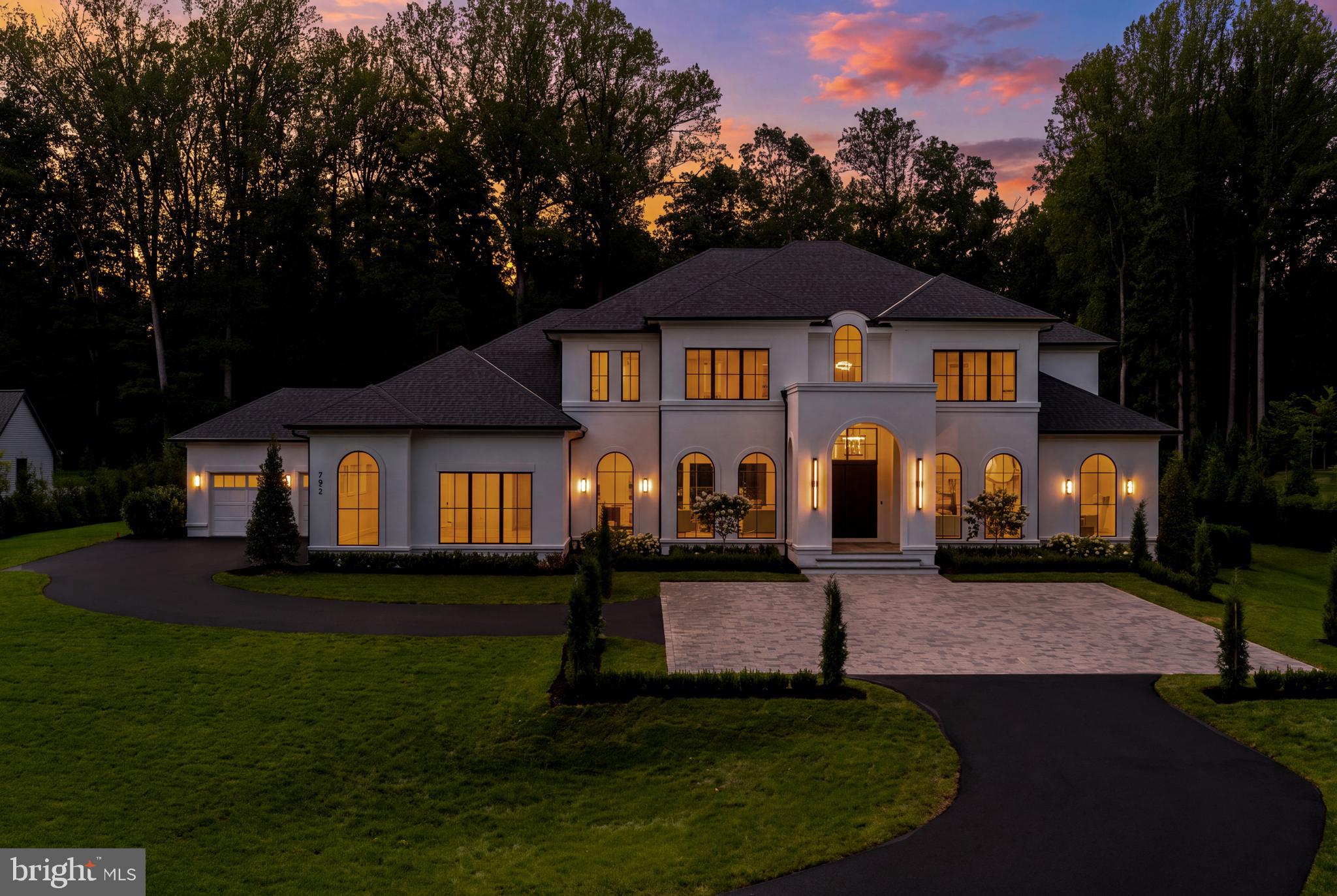 Fully completed, beautifully staged, and ready for immediate move-in, this truly exceptional custom estate presents a rare opportunity in the prestigious Falls Farm community. Set on a private 1.73-acre homesite, this extraordinary residence offers more than 11,000 square feet across three thoughtfully designed levels, with 6 bedrooms, 6 full baths, 3 half baths, and an outstanding floor plan created for both everyday living and entertaining on any scale.From the moment you enter, soaring ceilings, abundant natural light, and a dramatic curved staircase set the tone. Designed to anchor a spectacular multi-level chandelier, the staircase serves as an architectural centerpiece while the open, flowing layout effortlessly connects the home’s formal and informal living spaces. Three fireplaces add warmth and ambiance throughout.The main level is exceptionally functional, featuring two private offices, a beautifully appointed guest suite, elevator access, and a fully equipped spice kitchen. Whether hosting an intimate dinner, a large celebration, or simply enjoying a quiet evening at home, the floor plan delivers the space, flow, and flexibility to accommodate it beautifully.The primary suite is a private retreat with a spa-inspired bath featuring a Jacuzzi tub and luxurious steam shower, along with an impressive custom-designed closet. The lower level takes wellness and recreation to another level with a large fitness center and private spa featuring a sauna, hot and cold plunge, and massage room, creating a resort-like experience without ever leaving home.Indoor and outdoor living flow seamlessly together. A screened loggia extends the living space outdoors, while a fully outfitted outdoor kitchen and fire pit create an exceptional setting for year-round entertaining, all surrounded by remarkable privacy.Additional features include a 4-car garage with EV charging, integrated smart home automation, timeless stucco exterior, architectural shingle roof, and a striking window package. Every detail has been thoughtfully considered, combining sophisticated design, outstanding craftsmanship, modern technology, wellness, and everyday functionality.The expansive backyard offers tremendous potential to create a private resort, with ample room for a pool, sports court, children's play area, or all three.Homes of this caliber, scale, quality, and value are rarely available. Fully completed, professionally staged, and ready to be enjoyed now, this is a truly exceptional home that must be experienced in person. An extraordinary opportunity that will not last.