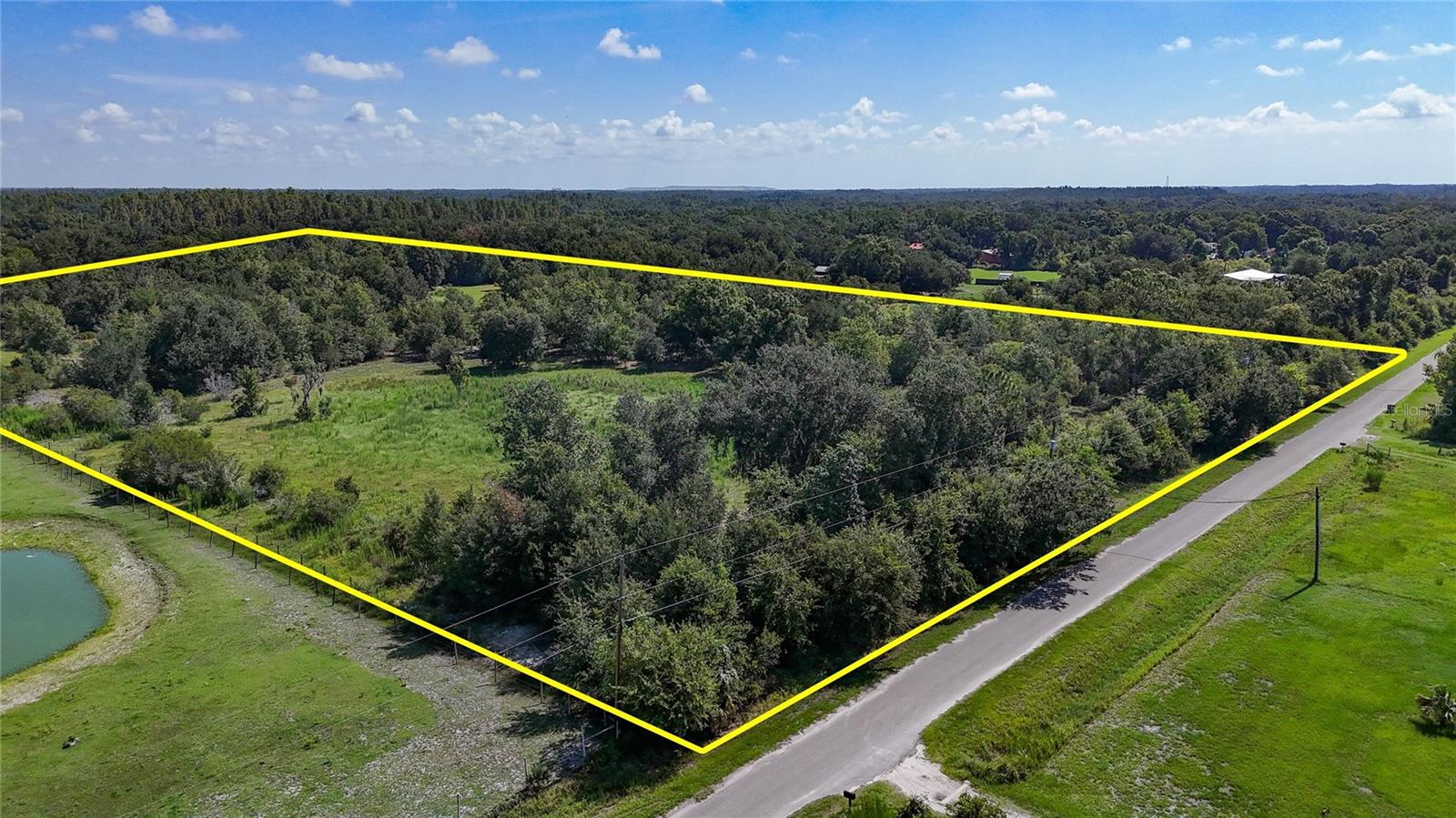 Virtually Staged. Exceptional development opportunity in Plant City—at a price that truly can’t be beat! This expansive 19.470-acre property stands out for its size, versatility, and potential, offering the opportunity to be subdivided into seven buildable lots, with one custom home permitted per approximately 2.5 acres. This creates an outstanding opportunity for a private residential compound, custom-home community, investment project, or long-term land hold. Buyers should independently verify all subdivision, zoning, density, access, utility, and development requirements with Hillsborough County.Located on Red Hawk Lane in Plant City, this property combines peaceful rural surroundings with convenient access to the Interstate 4 corridor. The area is known for its spacious acreage, mature trees, natural buffers, privacy, and quiet setting—an increasingly rare find within eastern Hillsborough County. With its generous 19.470 acres and thoughtful layout, the land provides ample room for strategic planning, scenic homesites, and the preservation of natural beauty, making it truly stand out among available properties in the area.Agricultural and residential possibilities provide flexibility for those interested in building a custom estate, keeping horses, raising livestock, or enjoying additional space without the restrictions of a homeowners association. The surrounding landscape features abundant native flora and fauna, neighborhood ponds, and nearby natural areas such as McIntosh Preserve, offering a serene environment ideal for outdoor enthusiasts and those seeking a connection to nature. The expansive acreage also allows for creative land use, whether for hobby farming, recreational space, or simply enjoying the privacy that comes with owning a larger parcel.Despite its tranquil country setting, the property offers convenient access to downtown Plant City, Lakeland, Tampa, and major employment centers throughout the I-4 corridor. Downtown Plant City’s historic charm, local restaurants, shops, community events, and the renowned Florida Strawberry Festival are only minutes away, adding to the appeal of this well-located property.