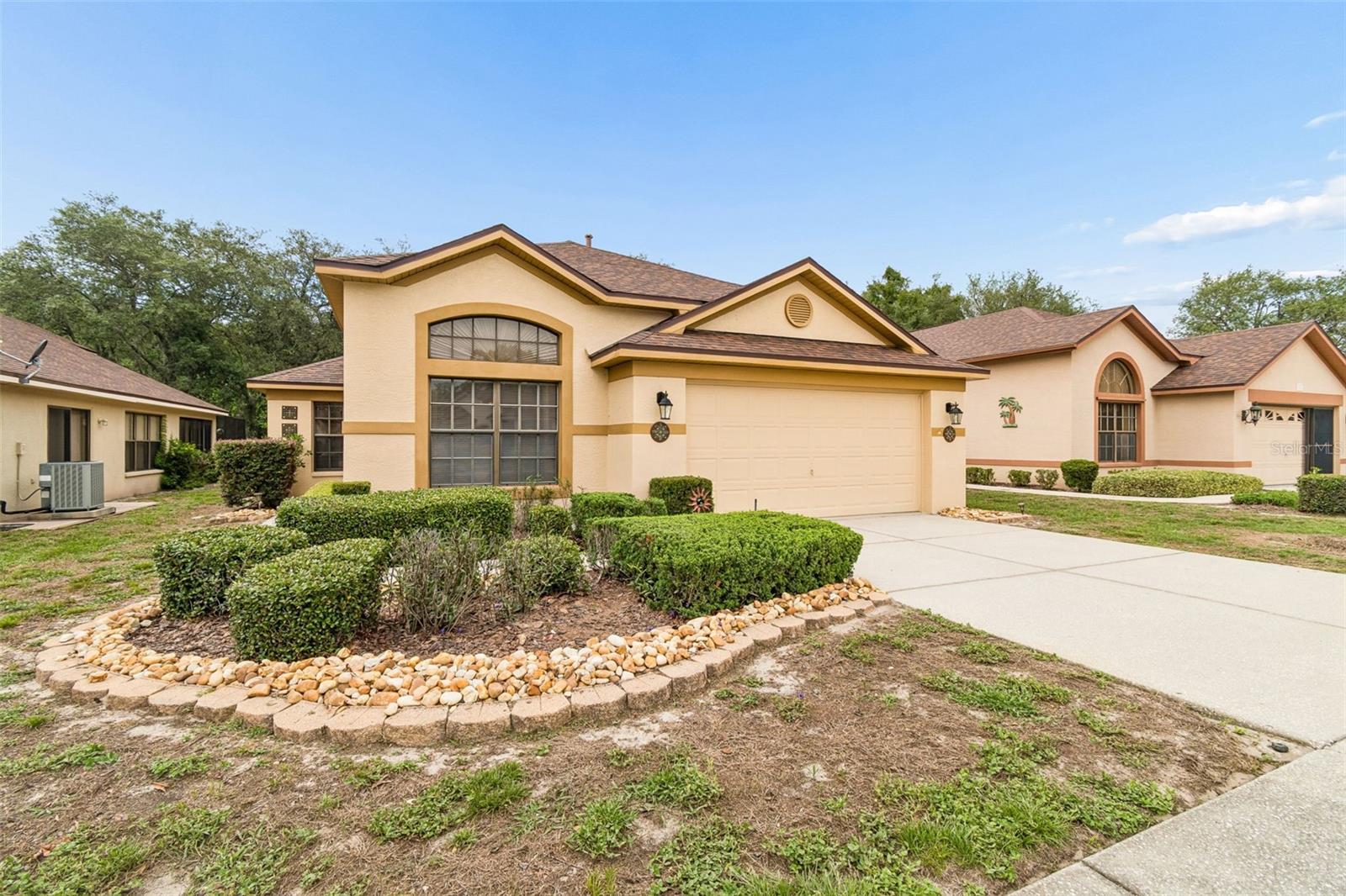 Nestled in the sought-after Preserve at Fairway Oaks, this beautifully updated home offers the perfect blend of comfort, convenience, and low-maintenance living. Surrounded by peaceful conservation views, NO REAR NEIGHBORS you'll enjoy a sense of privacy and tranquility while remaining just minutes from shopping, dining, and the Suncoast Parkway. Inside, soaring cathedral ceilings and an open, light-filled floor plan create an inviting atmosphere. Featuring 3 bedrooms or 2 bedrooms plus a flexible den/home office or formal dining room, this home adapts effortlessly to your lifestyle. NEW Neutral tile flooring throughout, a spacious family room, formal dining area, and an updated kitchen with granite countertops, stainless steel appliances, a gas range, breakfast bar, and eat-in dining space make everyday living both stylish and functional. The spacious primary suite serves as a private retreat, offering direct access to the screened lanai and a spa-like ensuite bath with a soaking tub, and separate walk-in shower. Step outside and relax on the screened patio overlooking serene conservation views—the perfect setting for morning coffee, evening sunsets, or entertaining family and friends. Great location walking distance to the community pool!Even better, the HOA handles the roof, exterior painting, and community pool maintenance and lawn care, allowing you to enjoy a true lock-and-leave lifestyle with less work and more time for what matters most.Conveniently located near Publix, Aldi, restaurants, medical facilities, and major commuter routes, this move-in-ready home offers exceptional value whether you're a first-time buyer, downsizing, or looking for an investment property. Beautiful views, beautiful home, maintenance-free living, and an unbeatable location—this one checks all the boxes. Schedule your private showing today!