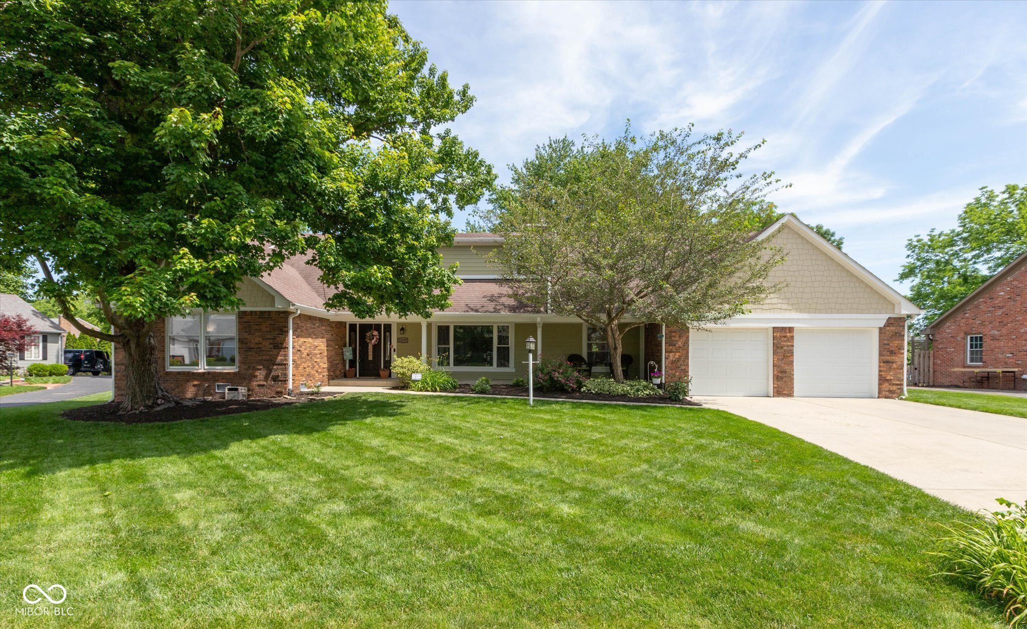 New, Improved Price! This fresh price adjustment makes this spacious home an incredible value and a fantastic opportunity to move into Brookshire-one of Carmel's favorite neighborhoods. Extensively updated and meticulously maintained, this property offers the best of both worlds: classic Carmel character paired with major modern improvements. Nearly every major system has been replaced or upgraded, including a fully renovated kitchen, new siding, a newer furnace, A/C, water heater, sump pump, water softener, appliances, replacement windows throughout most of the home, and brand-new carpeting. Offering over 5,000 total square feet of space, the welcoming layout features a bright living room, formal dining room, and a warm family room with wood-beamed ceilings, built-ins, and a cozy fireplace that opens to a large deck and fully fenced backyard. The highly flexible floor plan includes a main-level primary suite, a second main-floor bedroom ideal for guests or a home office, and three generously sized upstairs bedrooms. Need more space? An unfinished walk-in attic provides excellent potential for future expansion, while the basement offers abundant storage and endless possibilities. Nestled in a community home to the Brookshire Pool Club and Brookshire Golf Course, you'll love the $100/yr HOA fees.. With all the major, expensive improvements already done for you, this home is truly move-in ready, deeply discounted in value, and prepared for its next chapter!