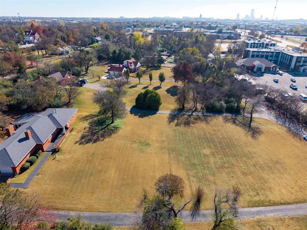 Home includes a 2025 heavy-comp roof, new bedroom flooring, two living areas, an attached two garage, and a deep front yard.